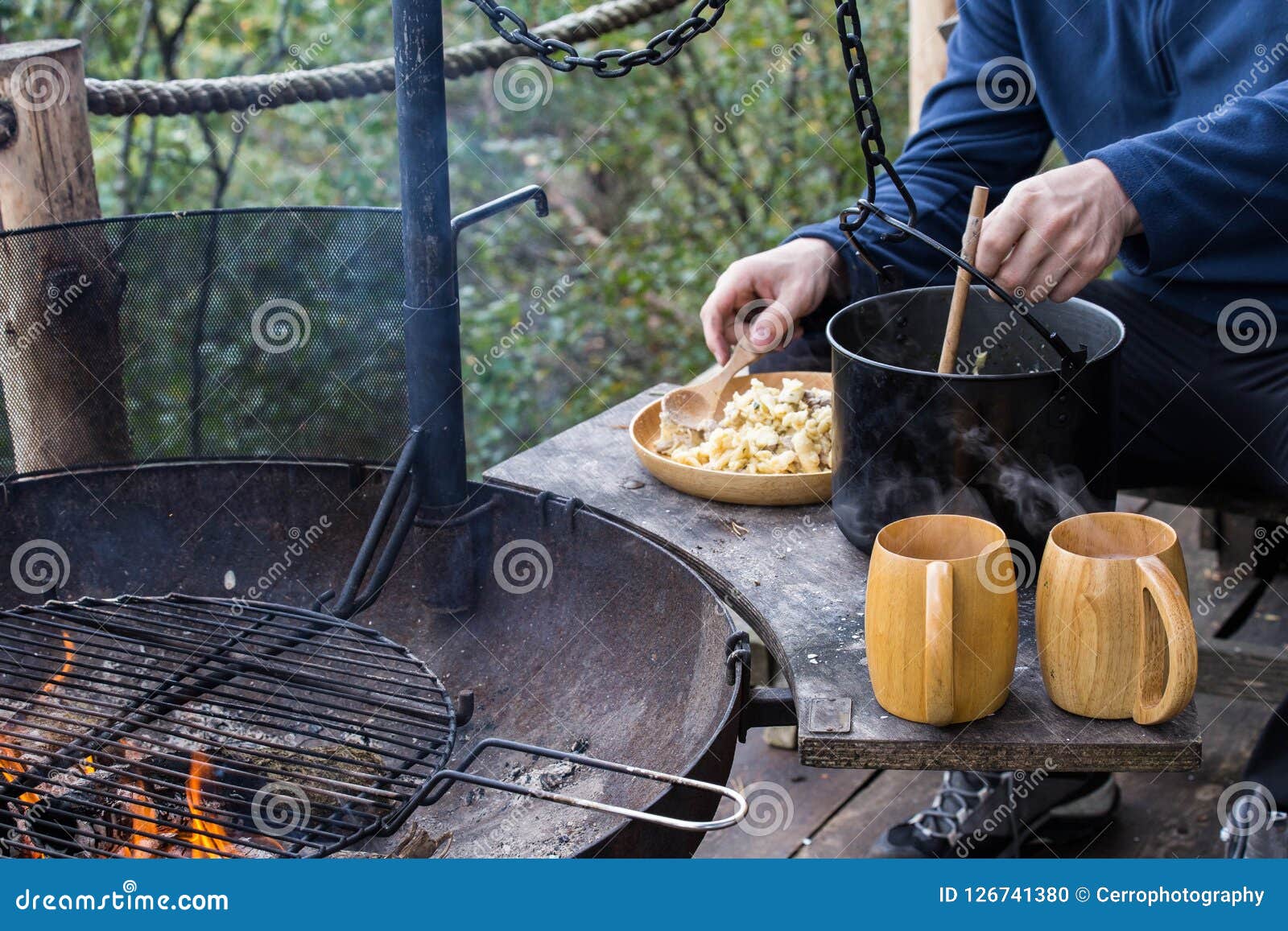 Frying Pan and a Pot on the Fire, Cooking Pasta while Camping Stock