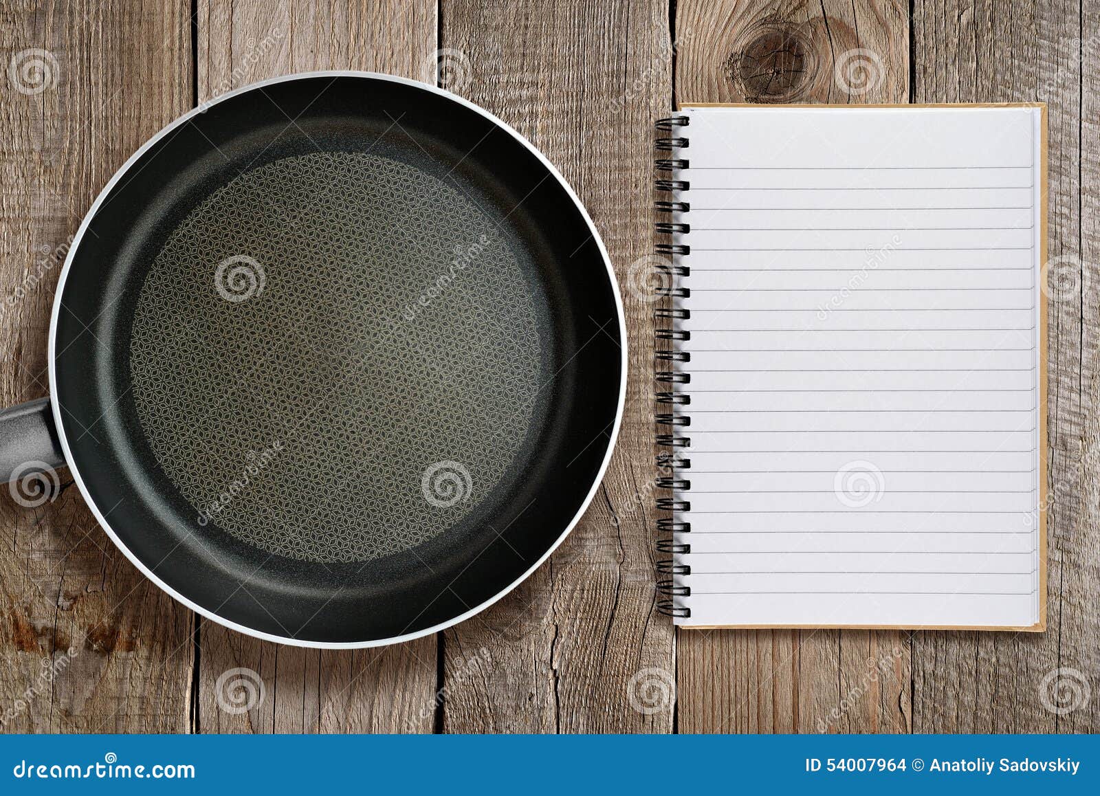 Frying pan and recipe book stock photo. Image of wood 54007964