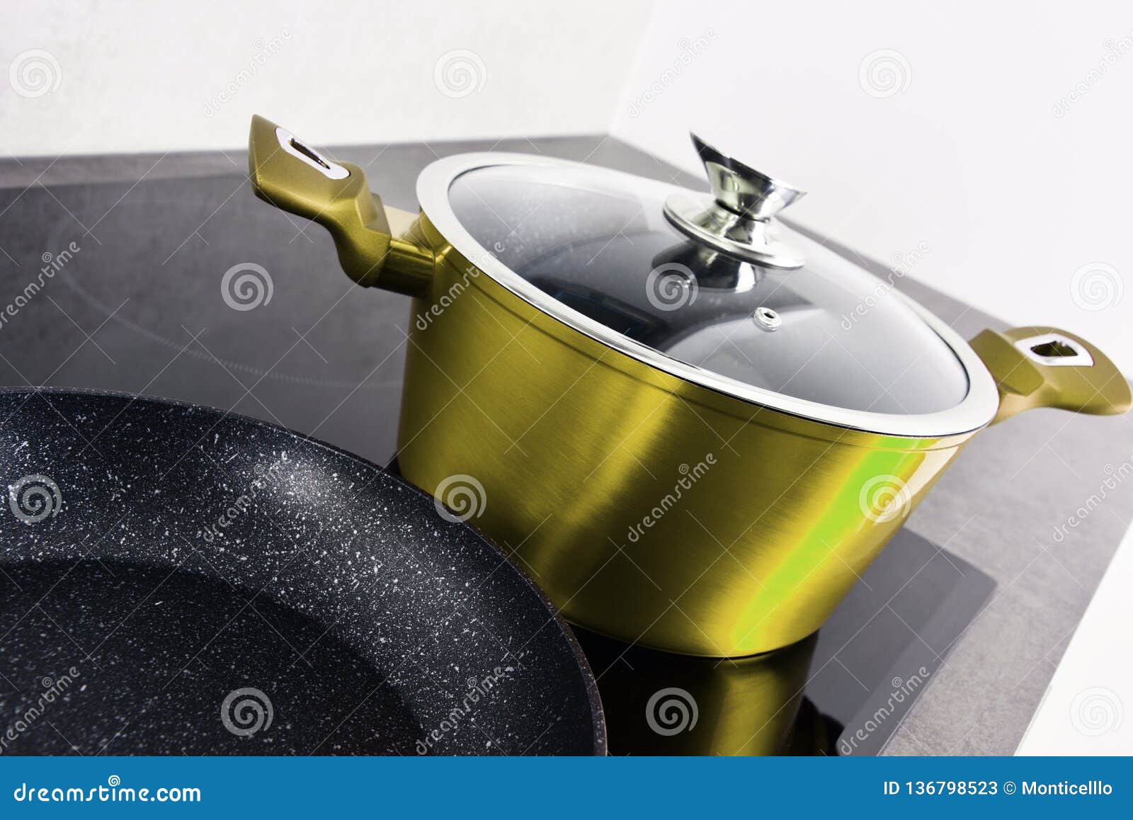 Frying Pan and Steel Pot on Modern Induction Cooktop Stock Image