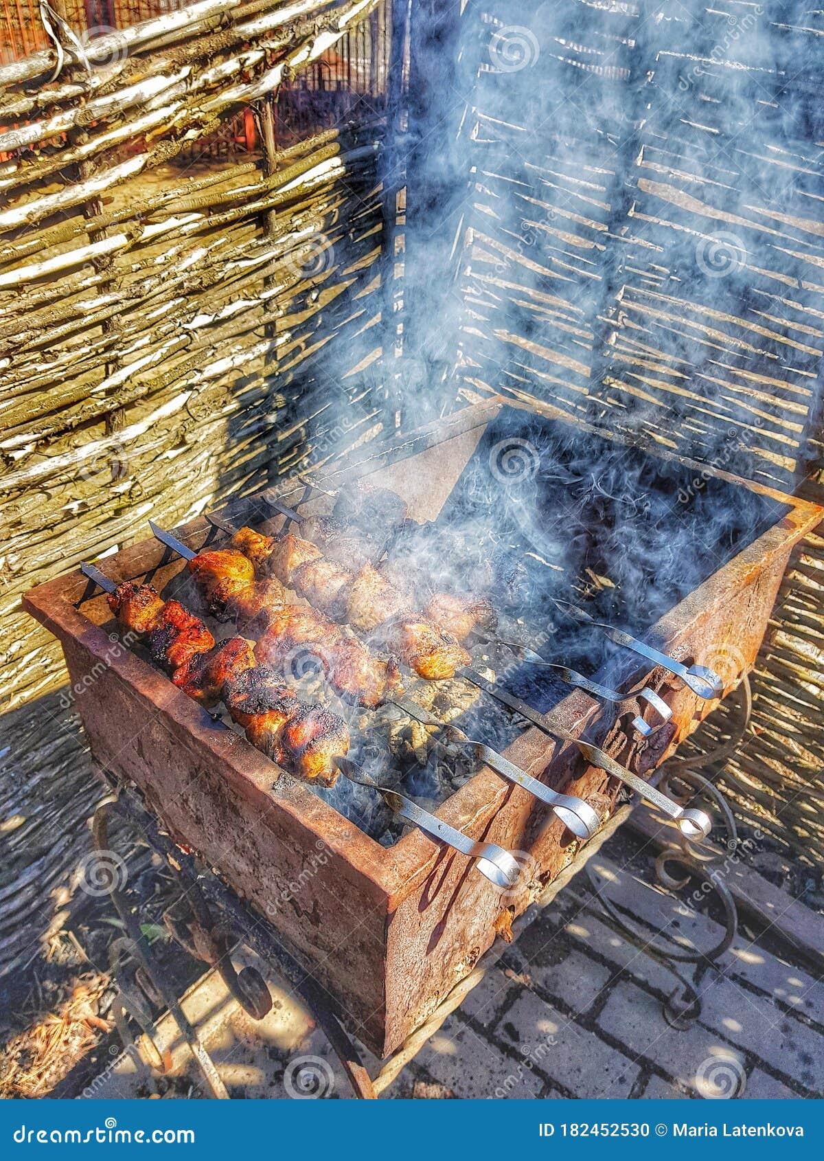 frying pork meat on the grill, barbegue in the open air.