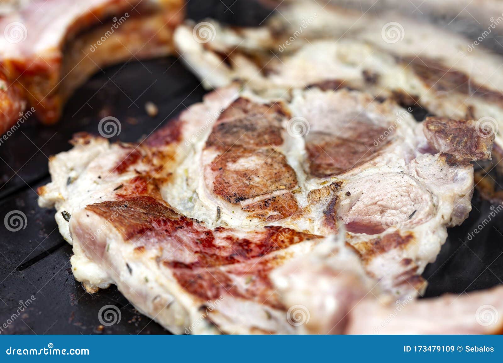 Frying pork neck on grill stock image. Image of closeup 173479109