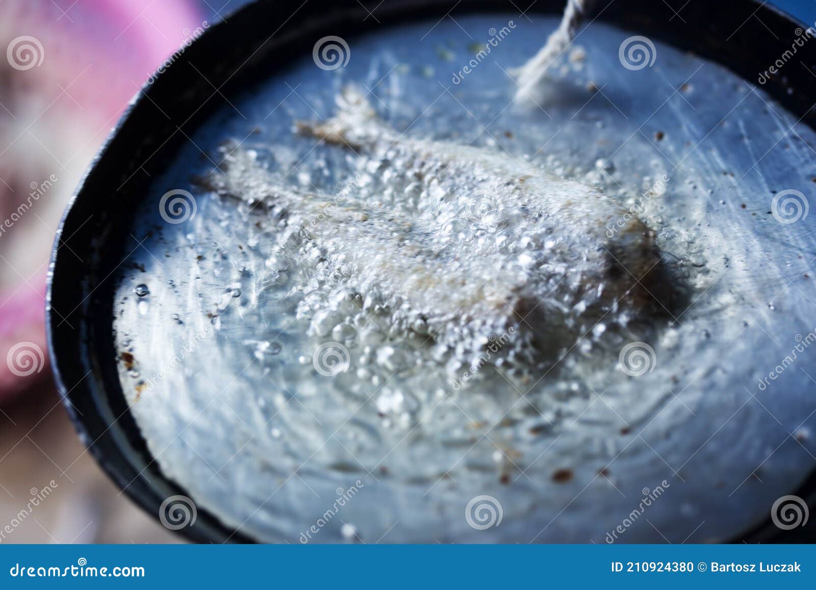 frying small sardines fish, chefchouen, morocco