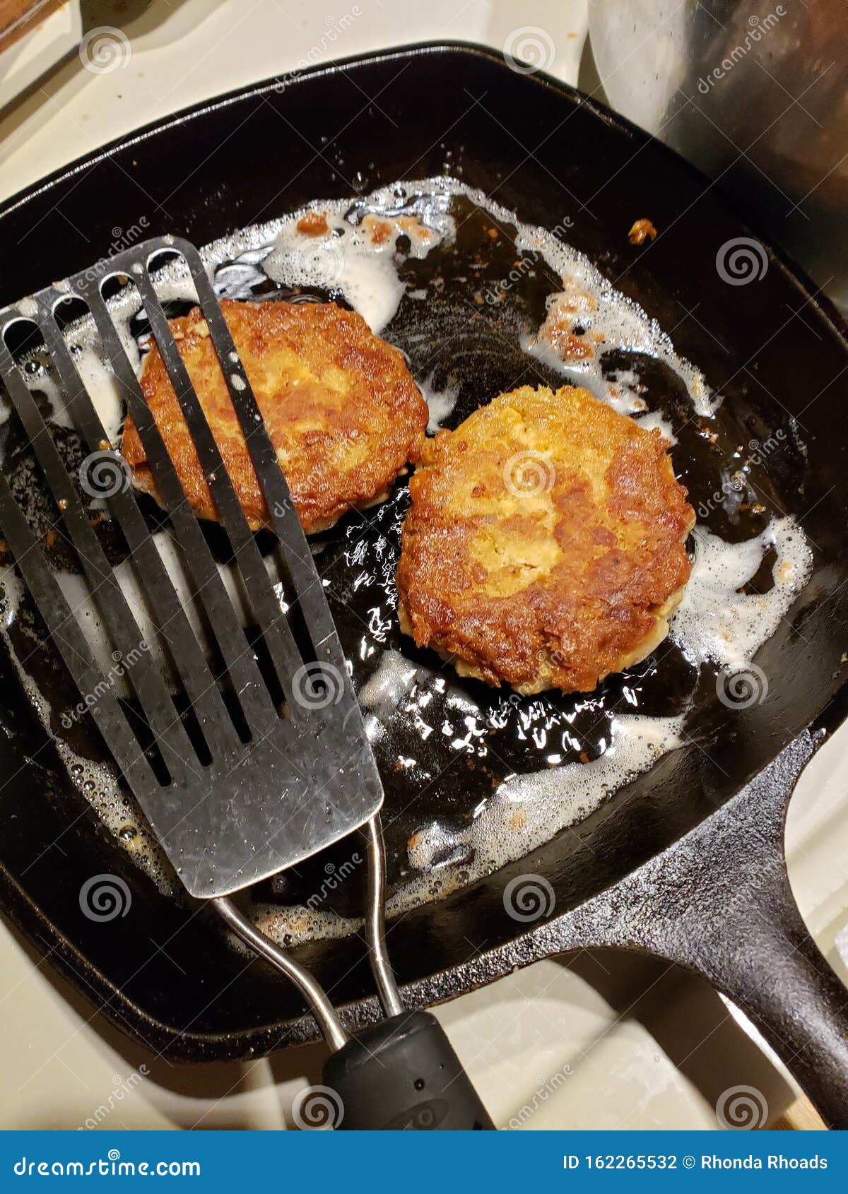 Salmon Patties in Skillet stock photo. Image of fish 162265532