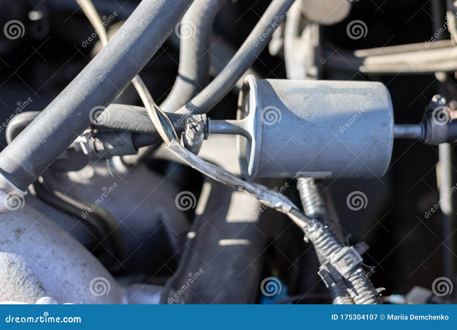 Fuel Filter Installed in a Car with a Fuel Line Connected To it Under