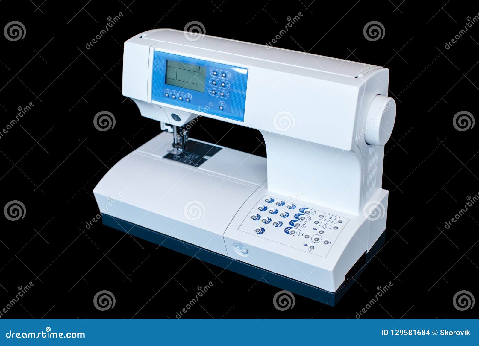 Full Automatic Sewing Machine Isolated on the Dark Background Stock