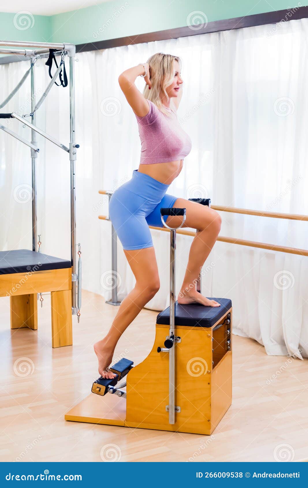 Fit Woman Exercising on Pilates Wunda Chair Stock Photo - Image of