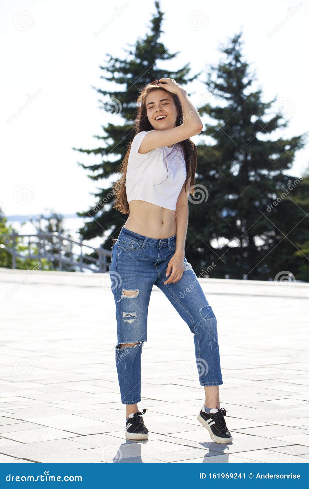 Young Beautiful Teenager Girl Posing Against Summer Park, Bright Sunny ...