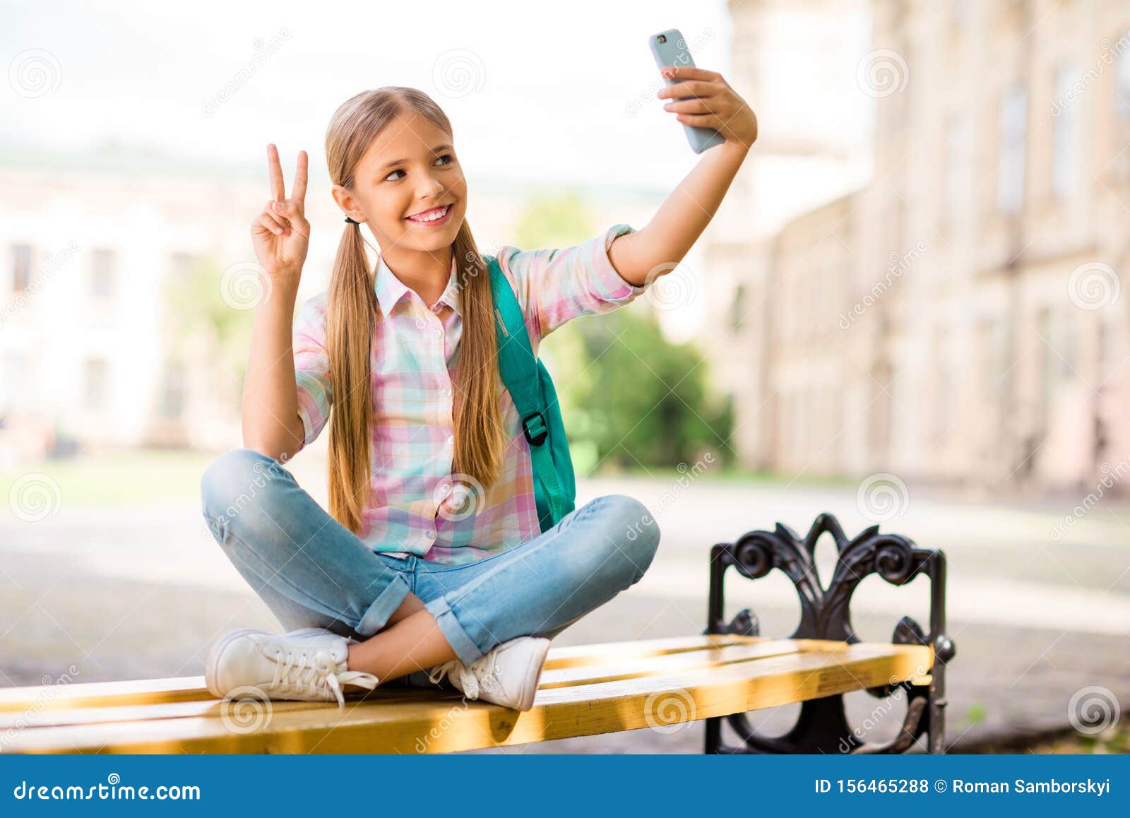 full body photo of cheerful student having pigtails ponytails make photo v-sign hold backpack rucksack wear plaid t