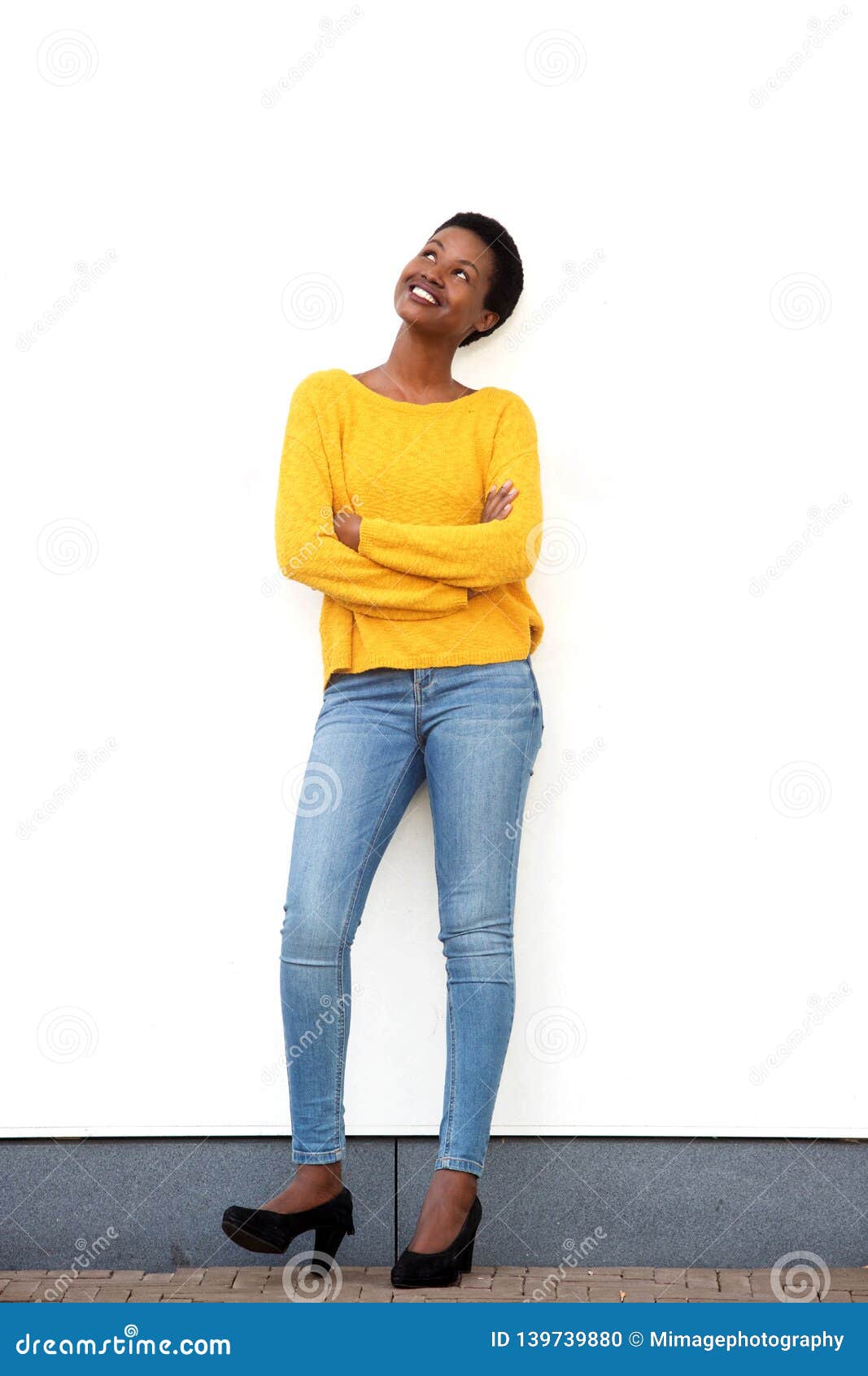 Woman Standing With Her Arms Apart Wearing Handbags Stock Photography