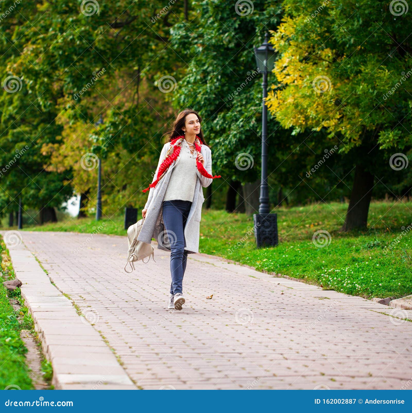 Portrait of a Young Beautiful Girl in Blue Jeans and Gray Coat Stock ...