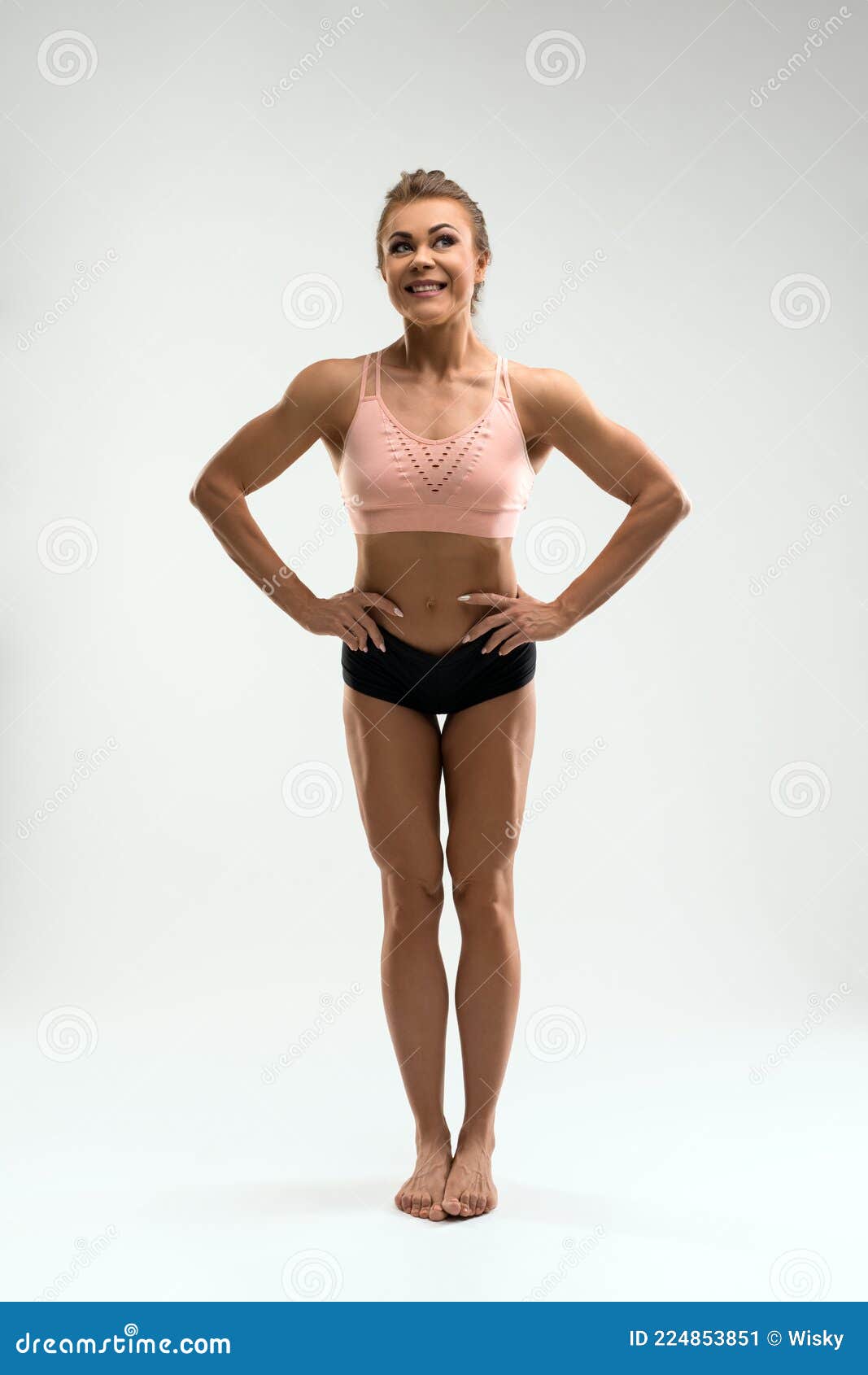 Happy Fit Woman in Sports Underwear Standing in Studio Stock Image
