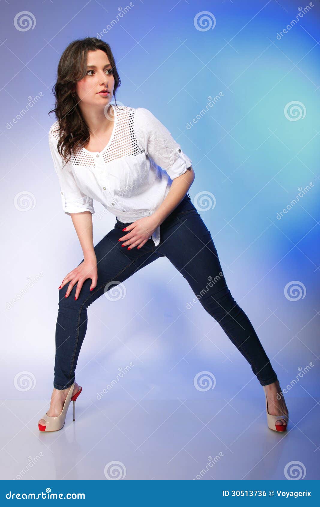 Young beautiful woman posing on white floor. Smiling female model full body  Stock Photo - Alamy
