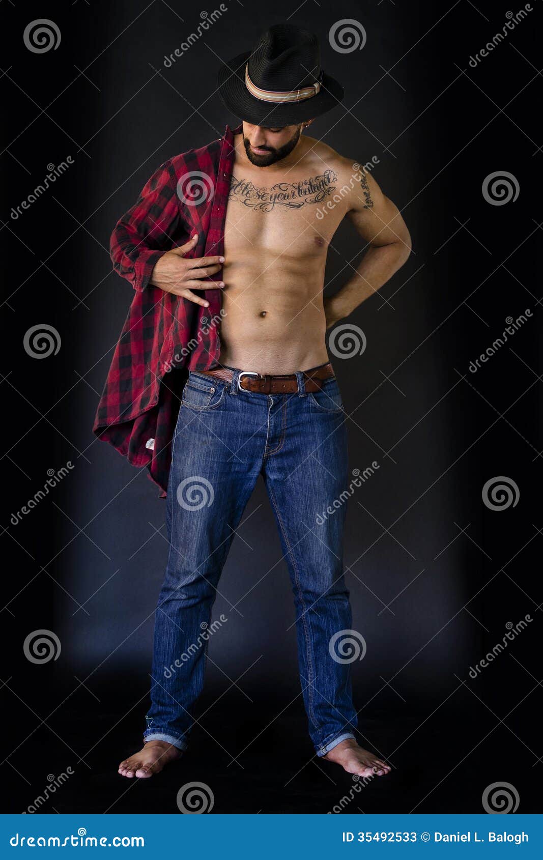 Download Full Body Of A Young Man, Putting On His Shirt, In Jeans ...