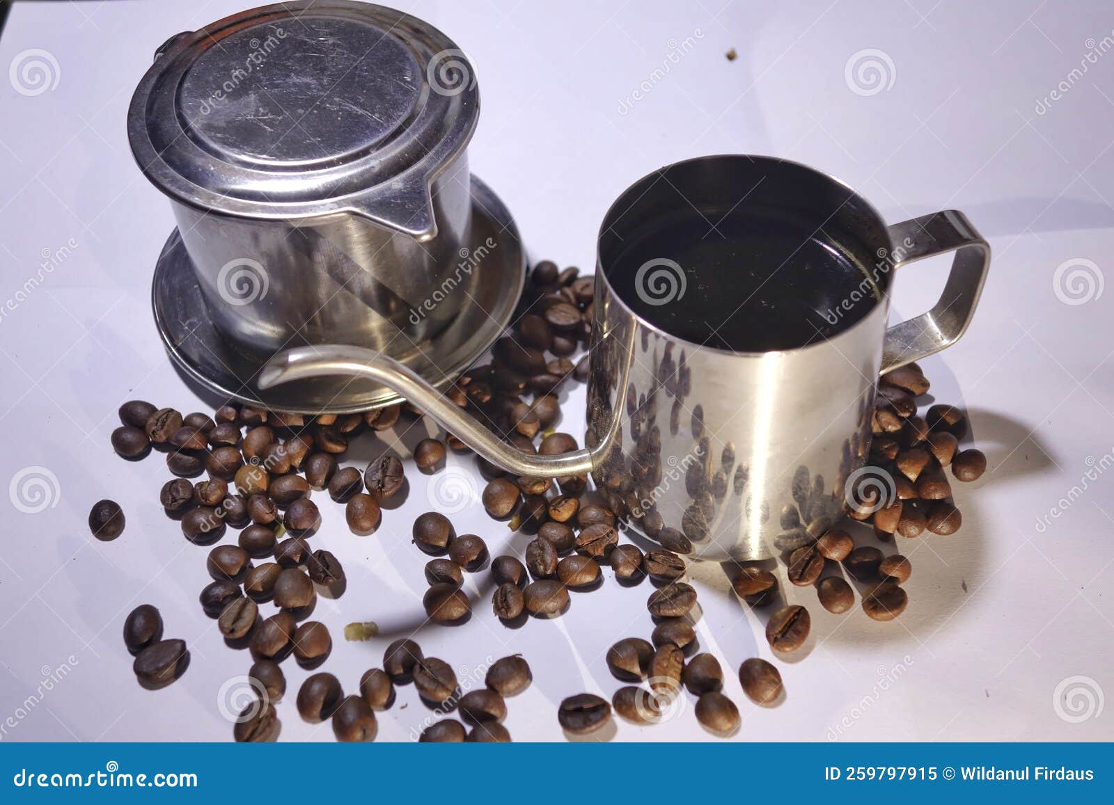 Full Fill of Black Coffee on Pot Surrounded by Coffee Beans Stock Image