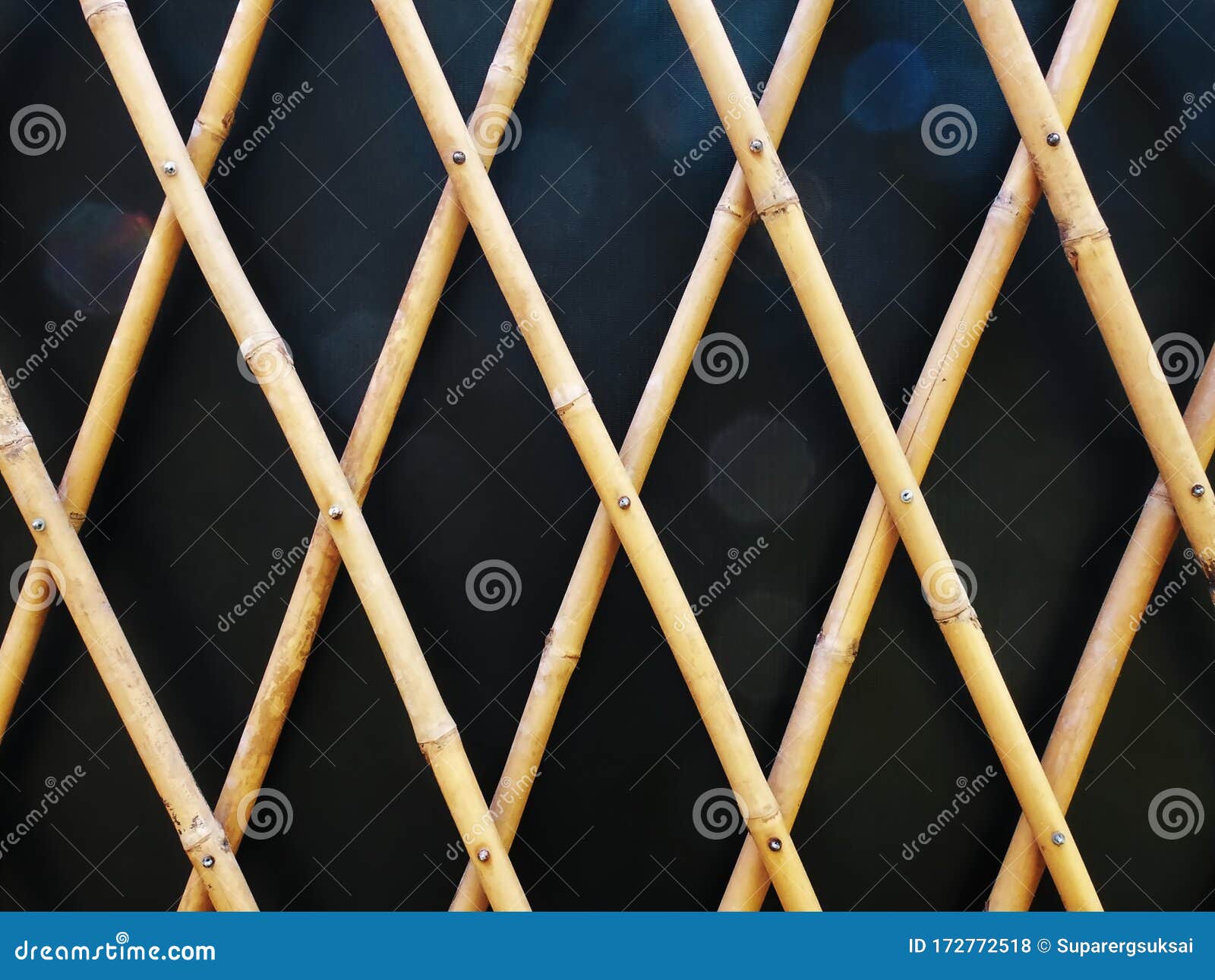 Decorative Bamboo Fence Pattern Against Black Wall Stock Photo Image