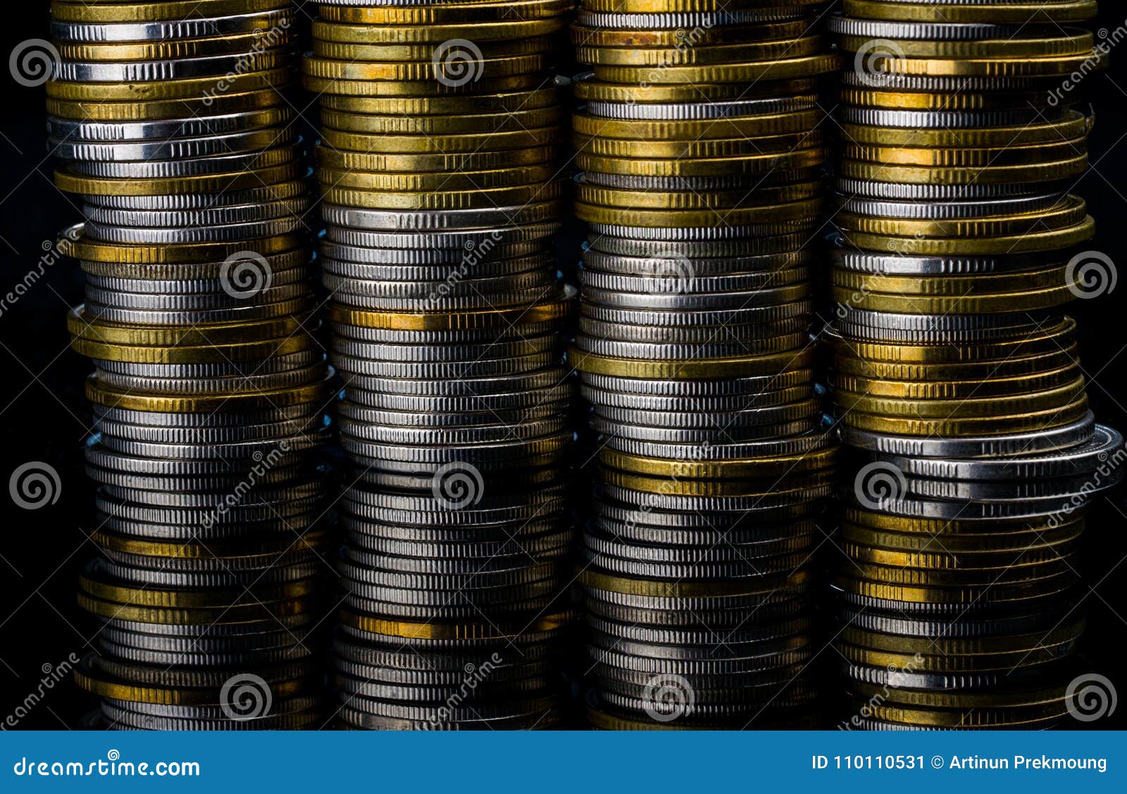 Golden And Silver Color Coin Stacks On Dark Background ...