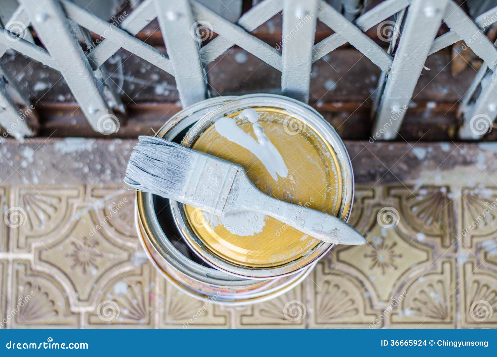 Full of Grey Paint Tin and Old Used Paintbrushes Set Stock Photo