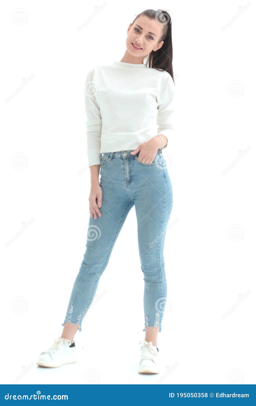 In Full Growth.a Pretty Young Woman in Casual Clothes Stock Photo ...