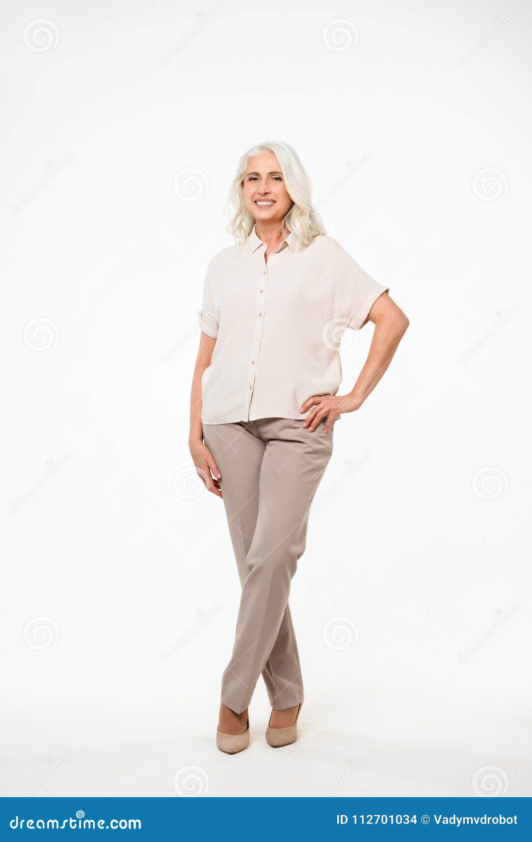 full-lenght photo of cheerful mature old woman