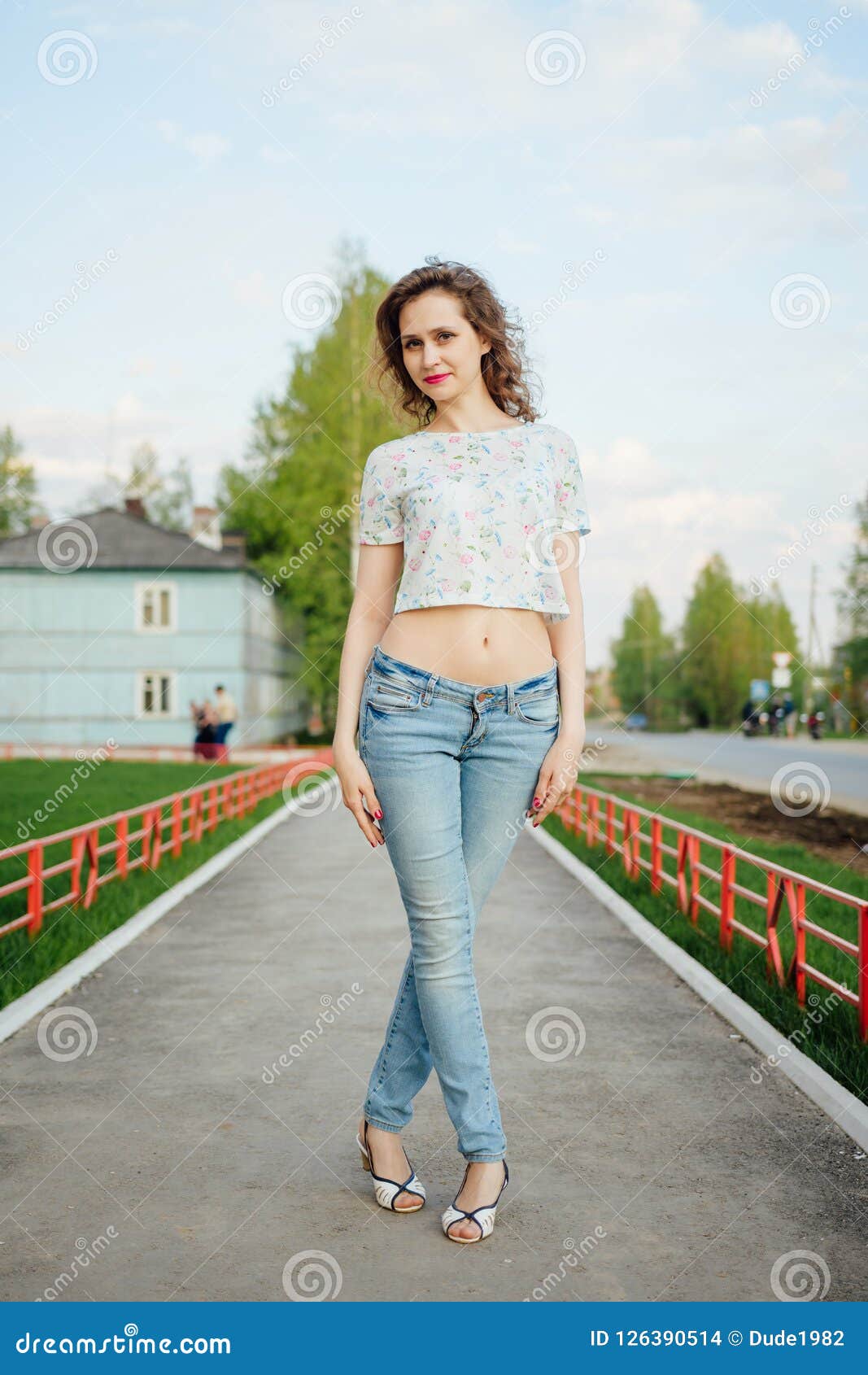 Full-length Beautiful Girl in Jeans Against a City Street Background ...