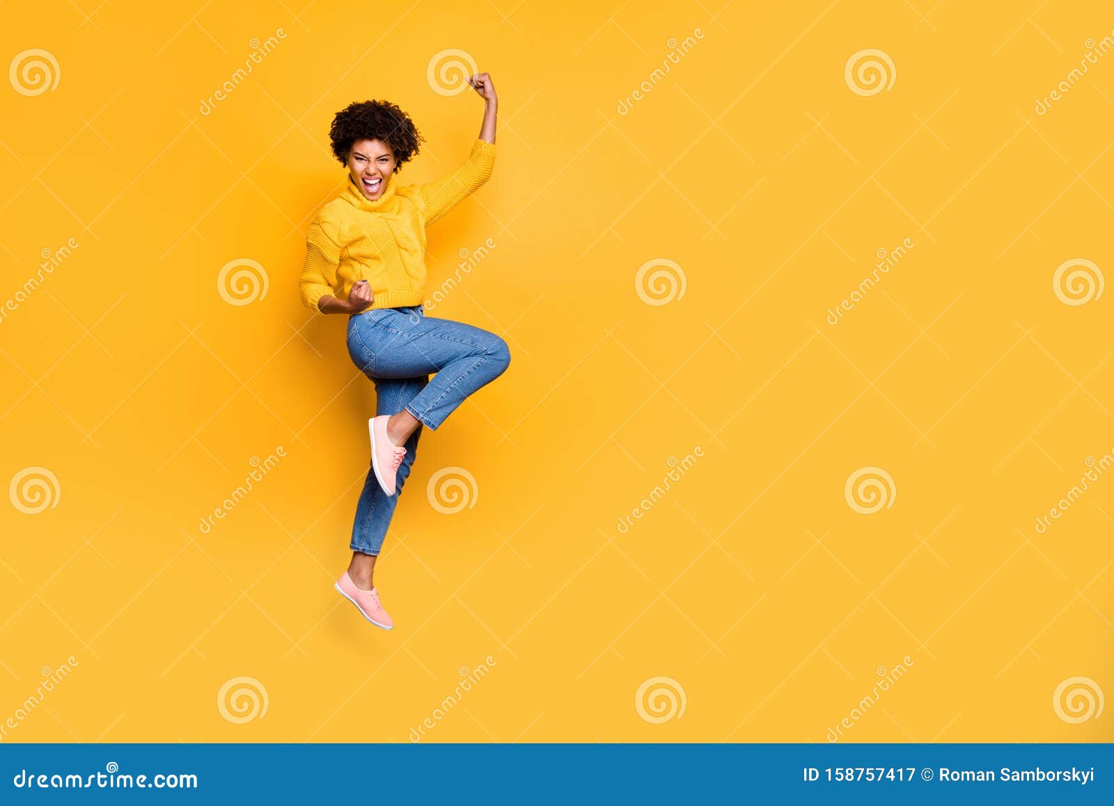 full length body size photo of jumping curly wavy strong and powerful black woman rejoicing with her victorious glory