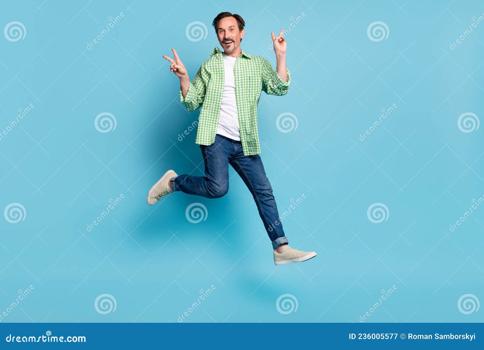Full Length Body Size View of Attractive Cheery Lucky Funny Man Jumping  Showing V-sign Isolated Over Bright Blue Color Stock Image - Image of glad,  jump: 236005577