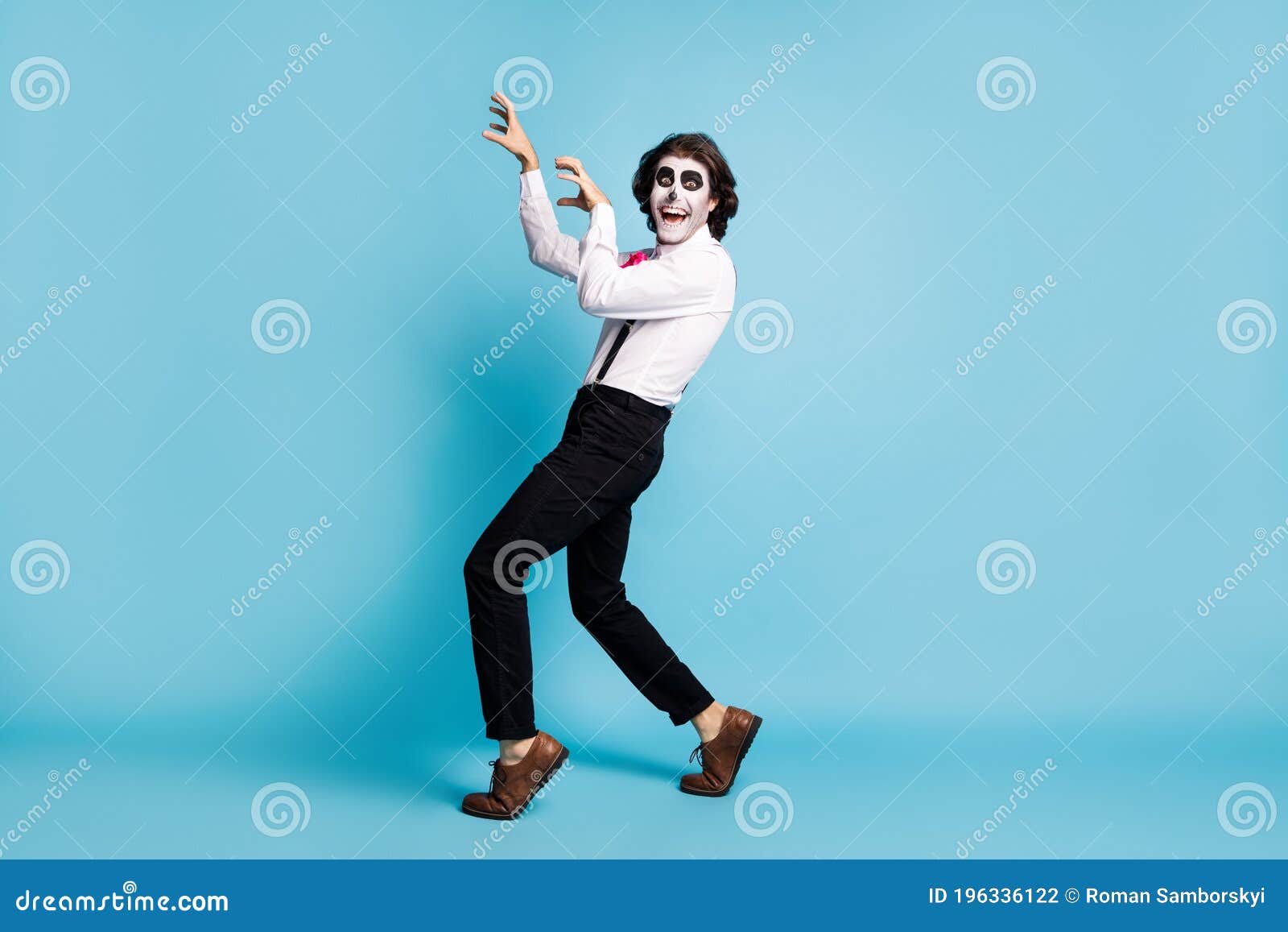 full length body size view of handsome funky cheerful cheery scary creepy baleful malicious gentleman having fun zombie