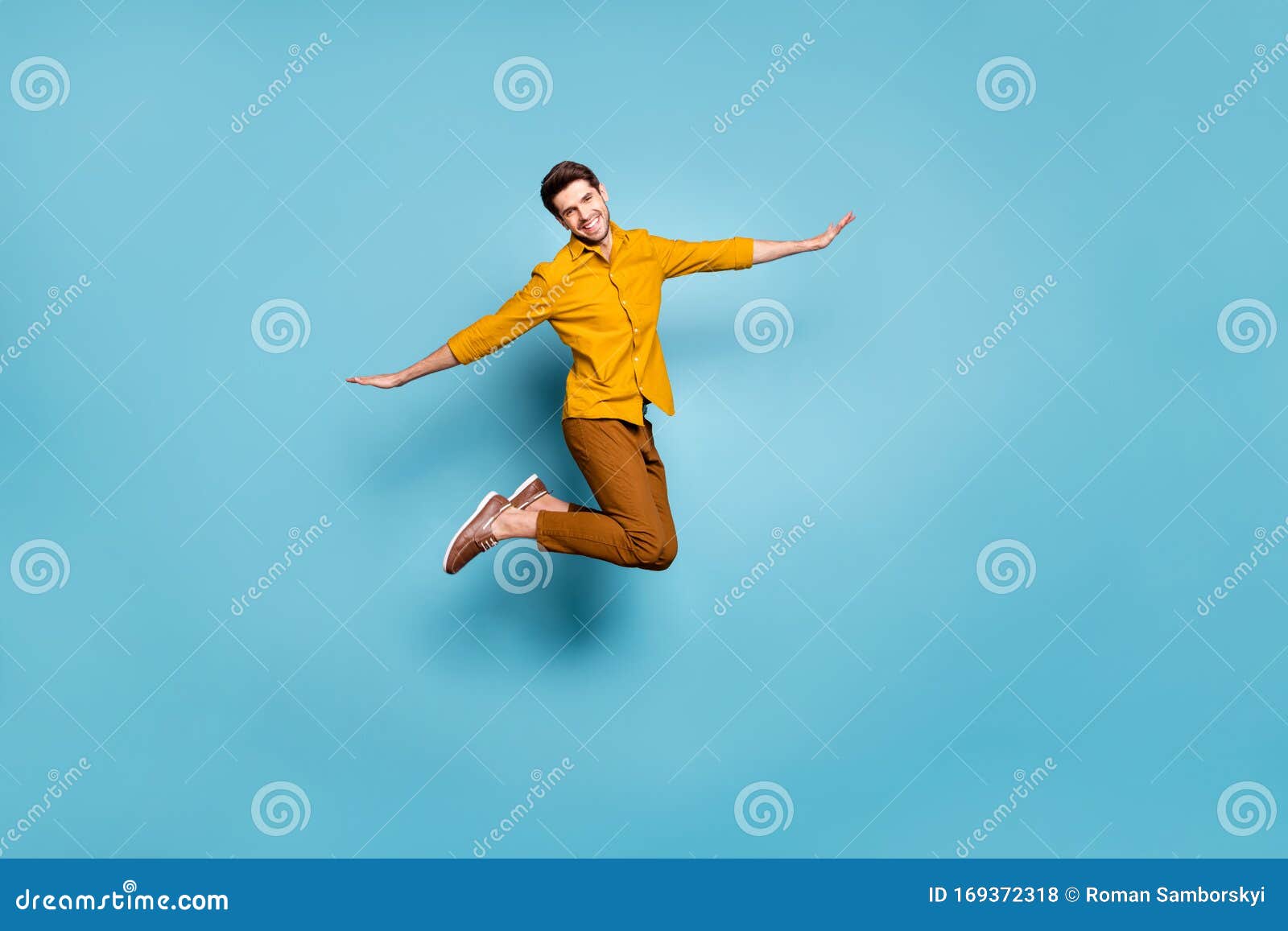 Full Length Photo of Crazy Guy Jumping High Holding Hands Spread by ...