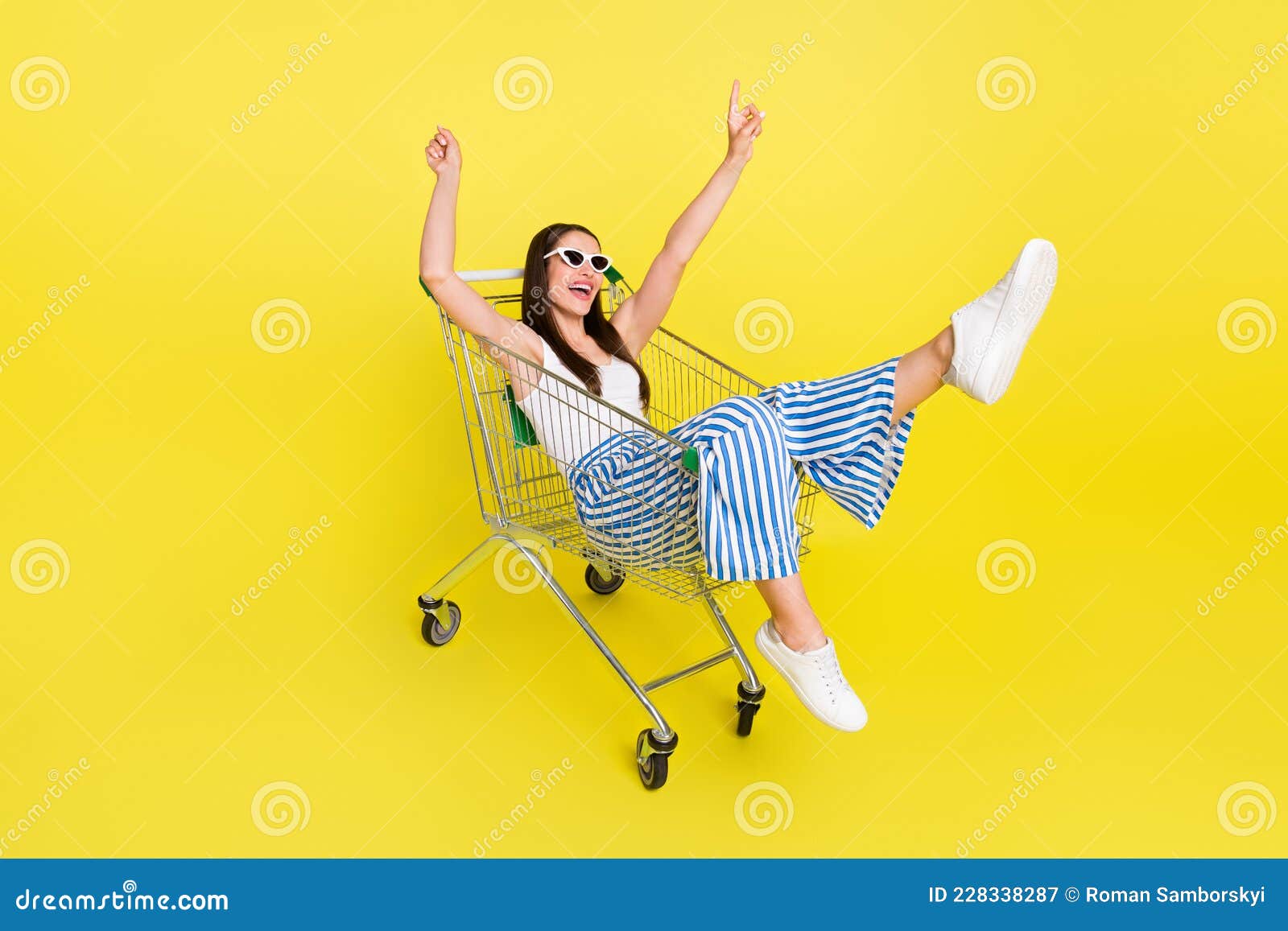 full length photo of funny brunette lady sit in trunk wear top pants spactacles  on yellow color background