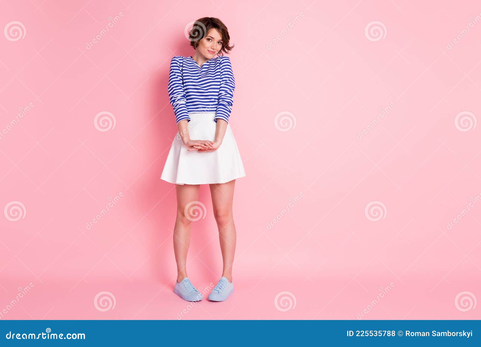 Full Length Photo of Shy Adorable Lady Hold Hands Wear Striped Shirt ...