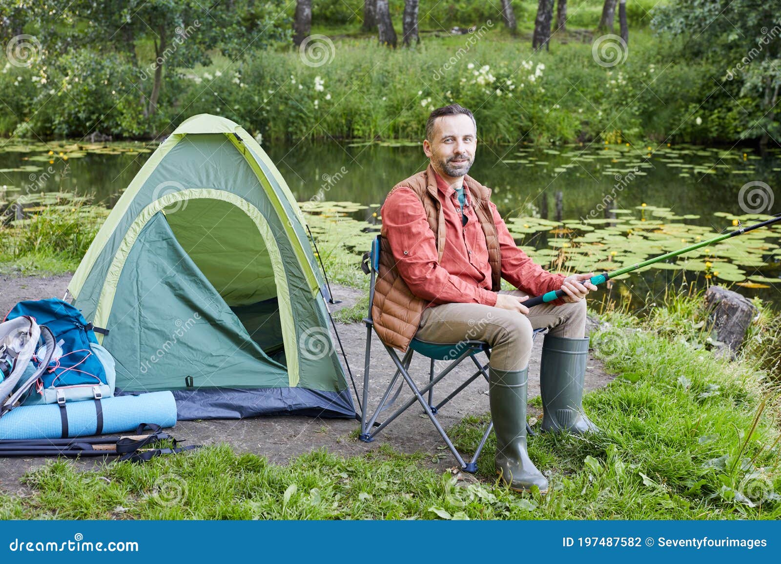 Mature Man Fishing by Lake stock photo. Image of happiness - 197487582