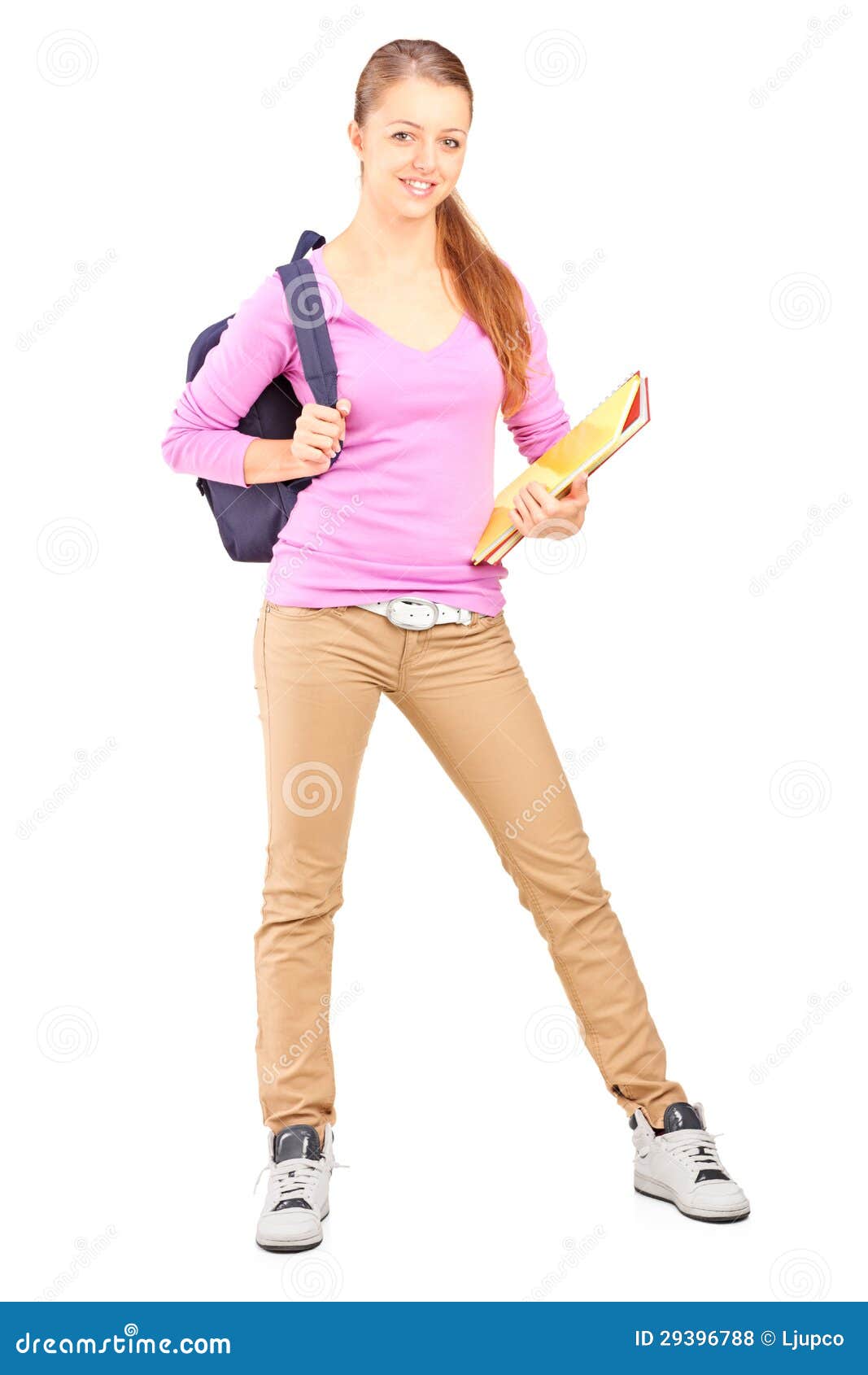Full Length Portrait Of A Female Student Holding Holding Backpack And
