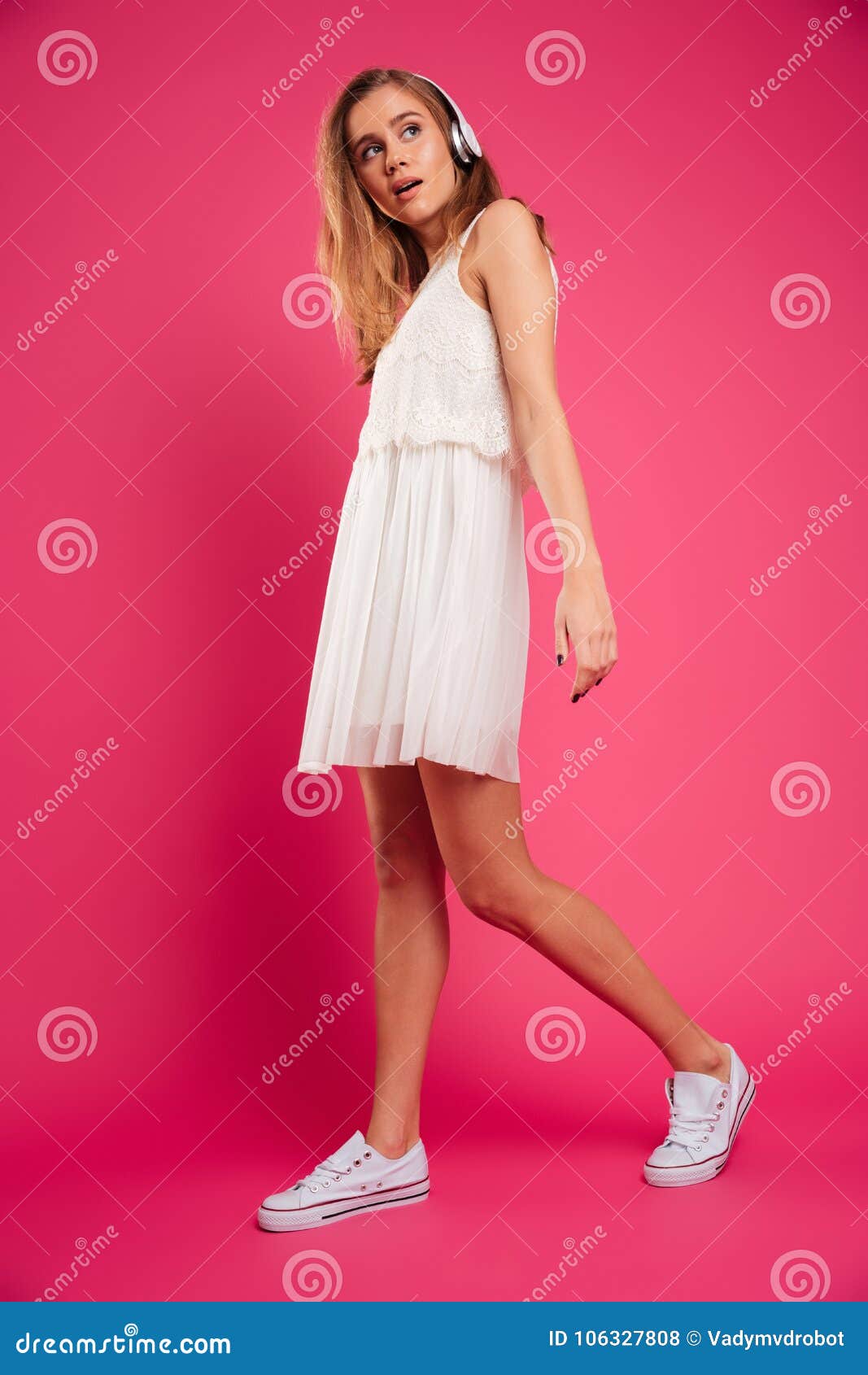 Full Length Portrait of a Pretty Girl Listening To Music Stock Photo ...