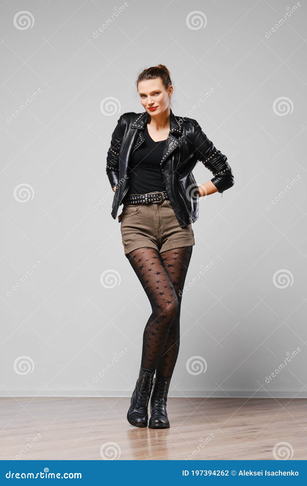 Full Length Portrait of a Woman in Leather Jacket, Shorts and Tights ...