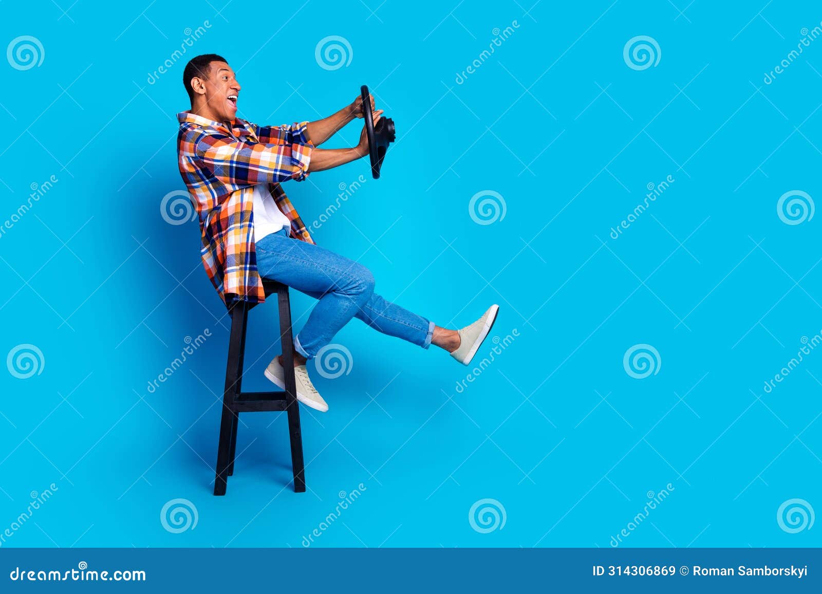full length profile photo of nice young man beep wheel empty space wear shirt  on blue color background