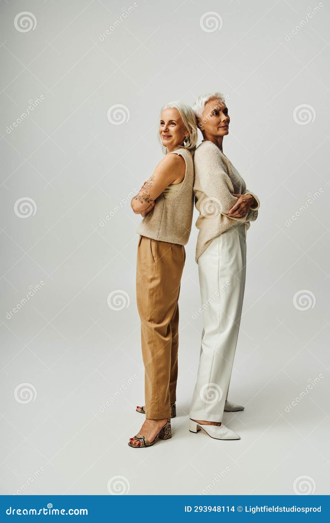 full length of senior fashionistas standing