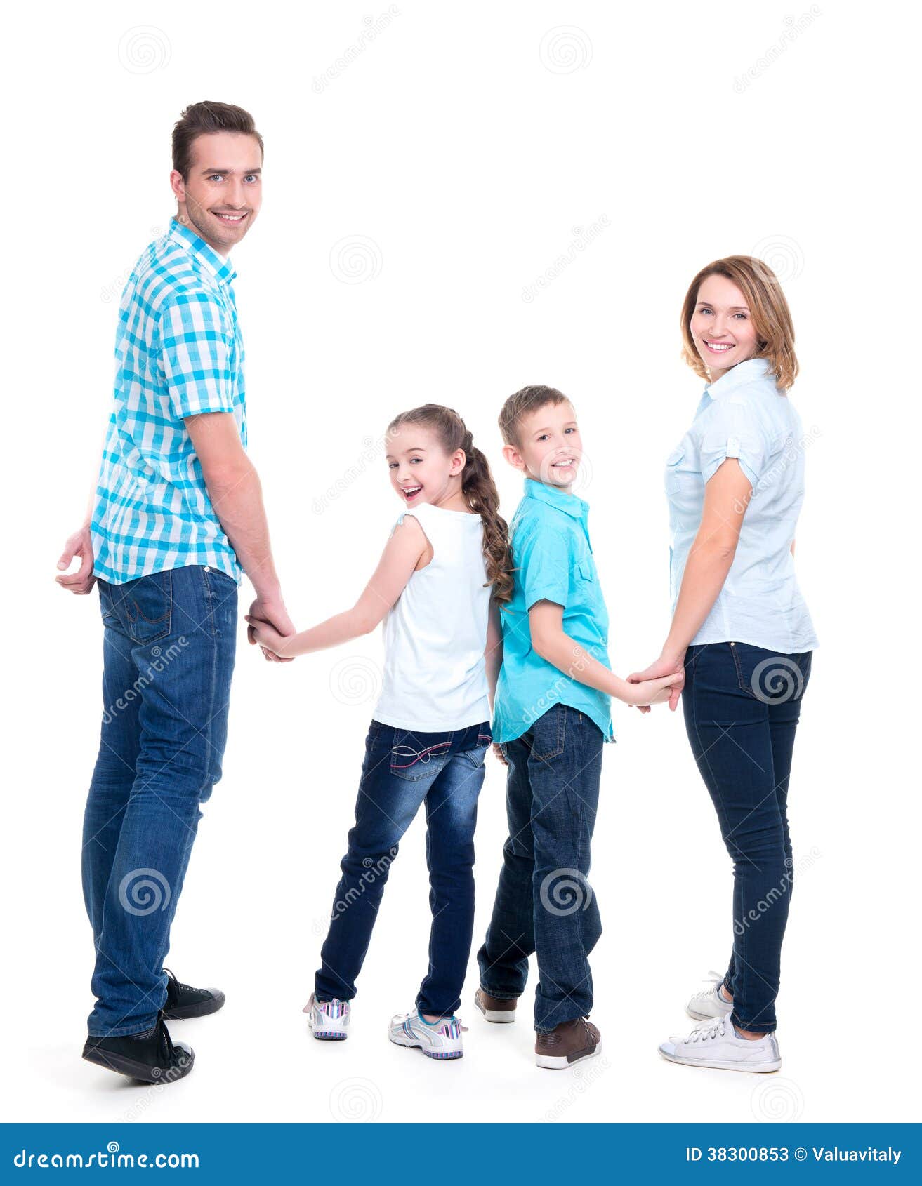 Portrait Of Happy Family Walking Over White Background Against