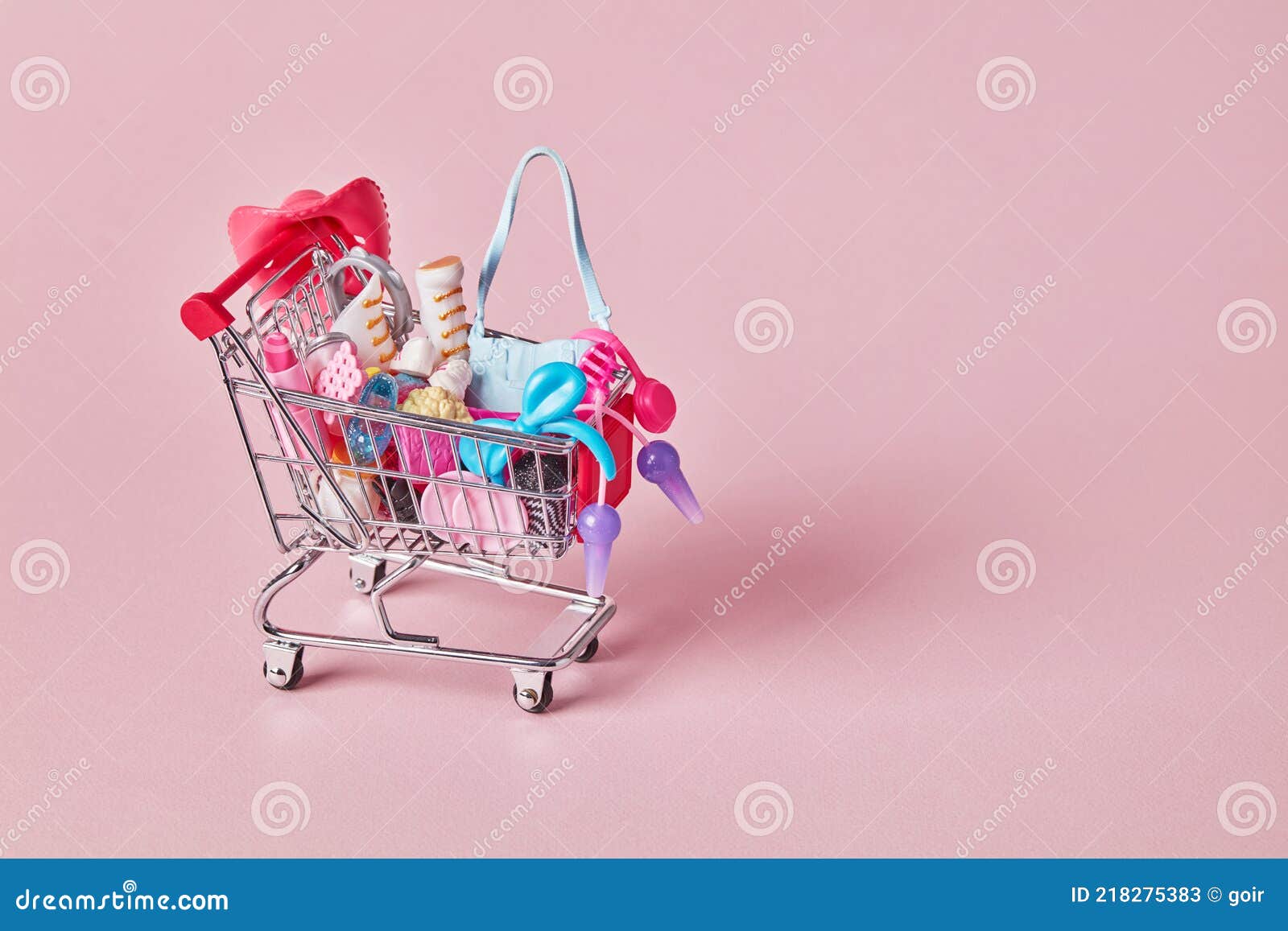 Full shopping cart on pink stock image. Image of cart 218275383