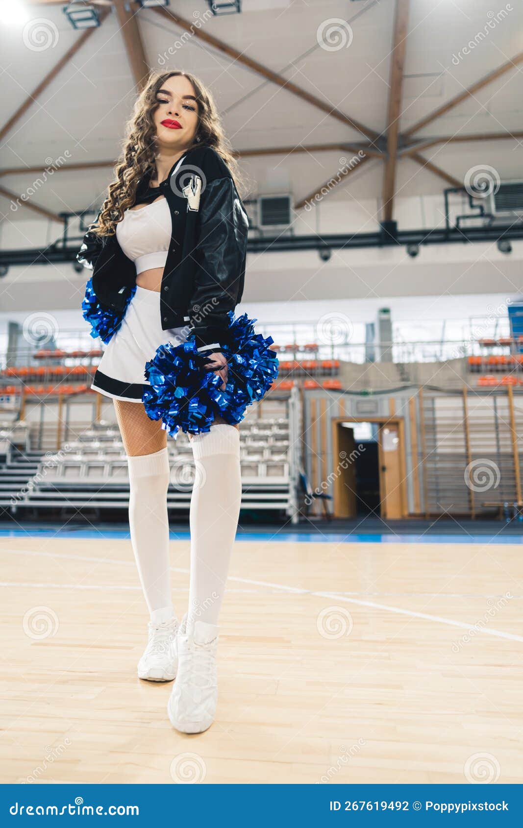 Cheerleader girl pose standing with pom-pom Stock Photo by ©studiomediaceh  55068527