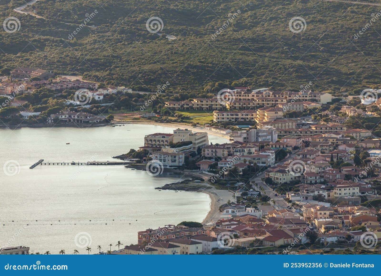 full view of the main beaches in golfo aranci, olbia, with buildings and town view
