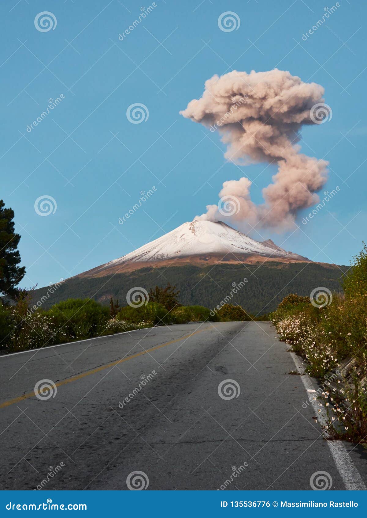 snowy popocatepetl volcano seen from the road