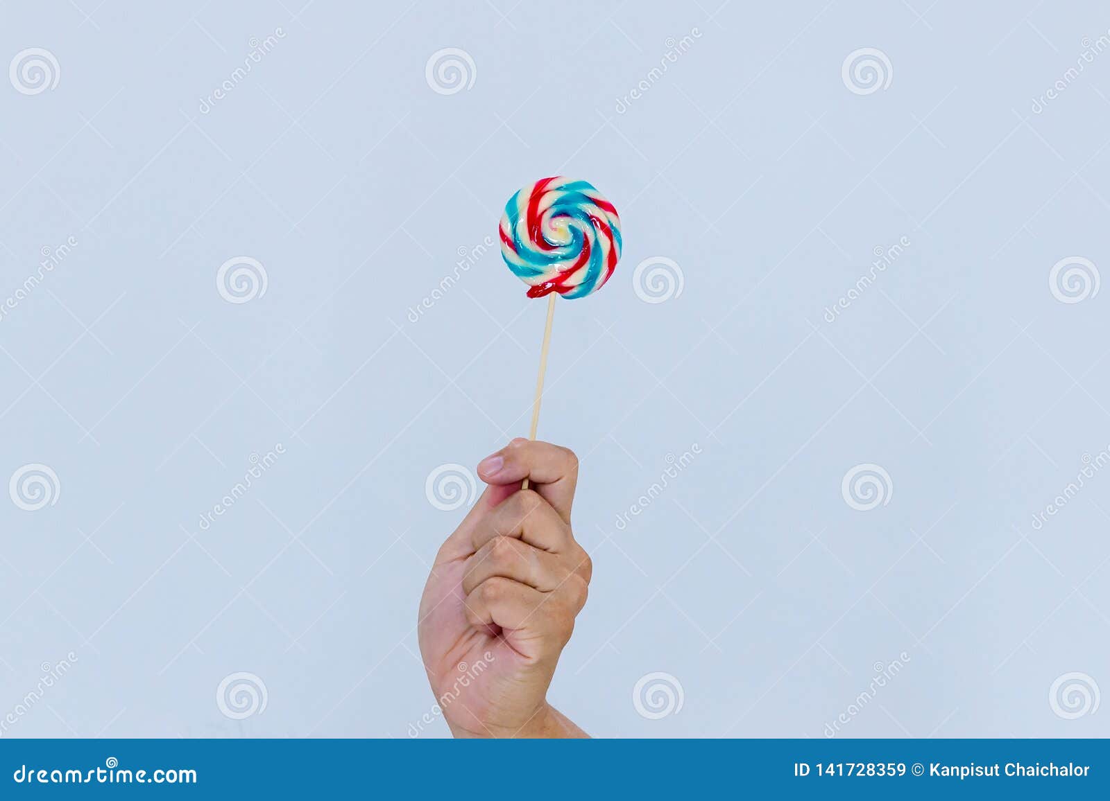 Fun And Celebration Concept.hand Holding Big Colorful Lollipop Candy On ...