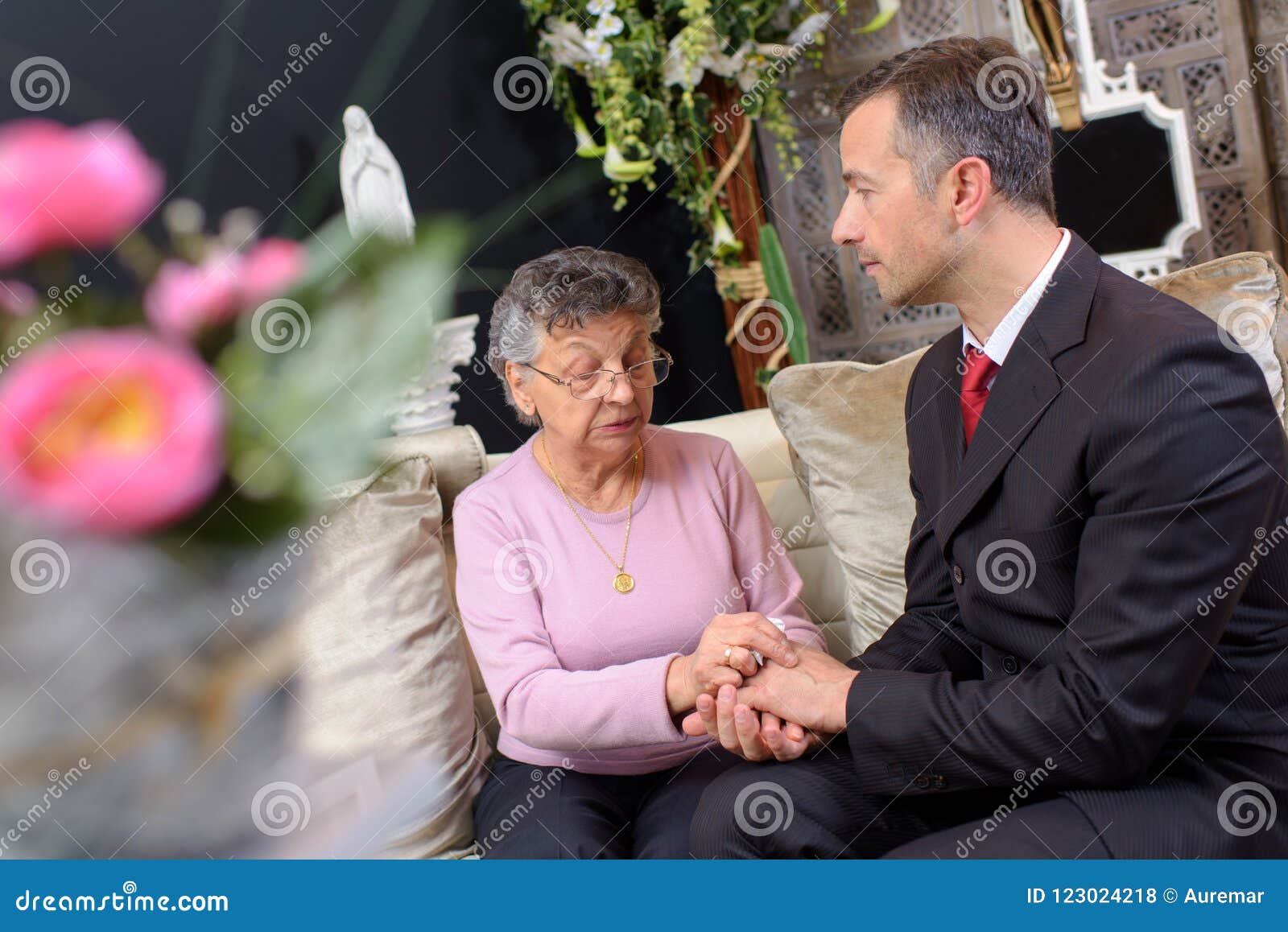 funeral director comforting woman