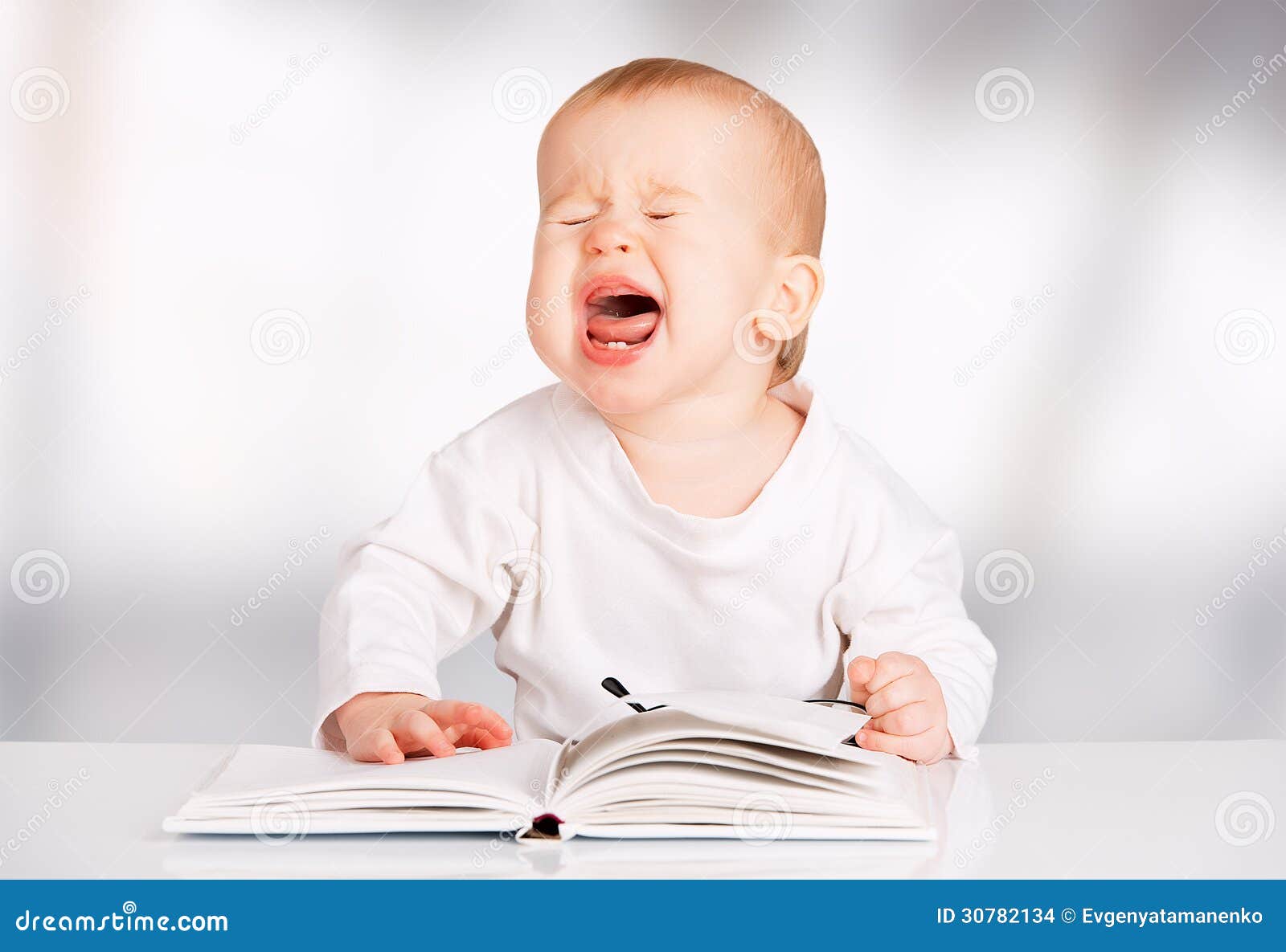 Funny Baby Reading a Book and Cries Stock Photo - Image of innocence,  beauty: 30782134