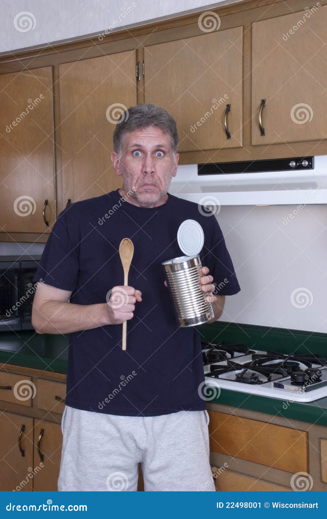 funny bachelor man cooking dinner eat from tin can