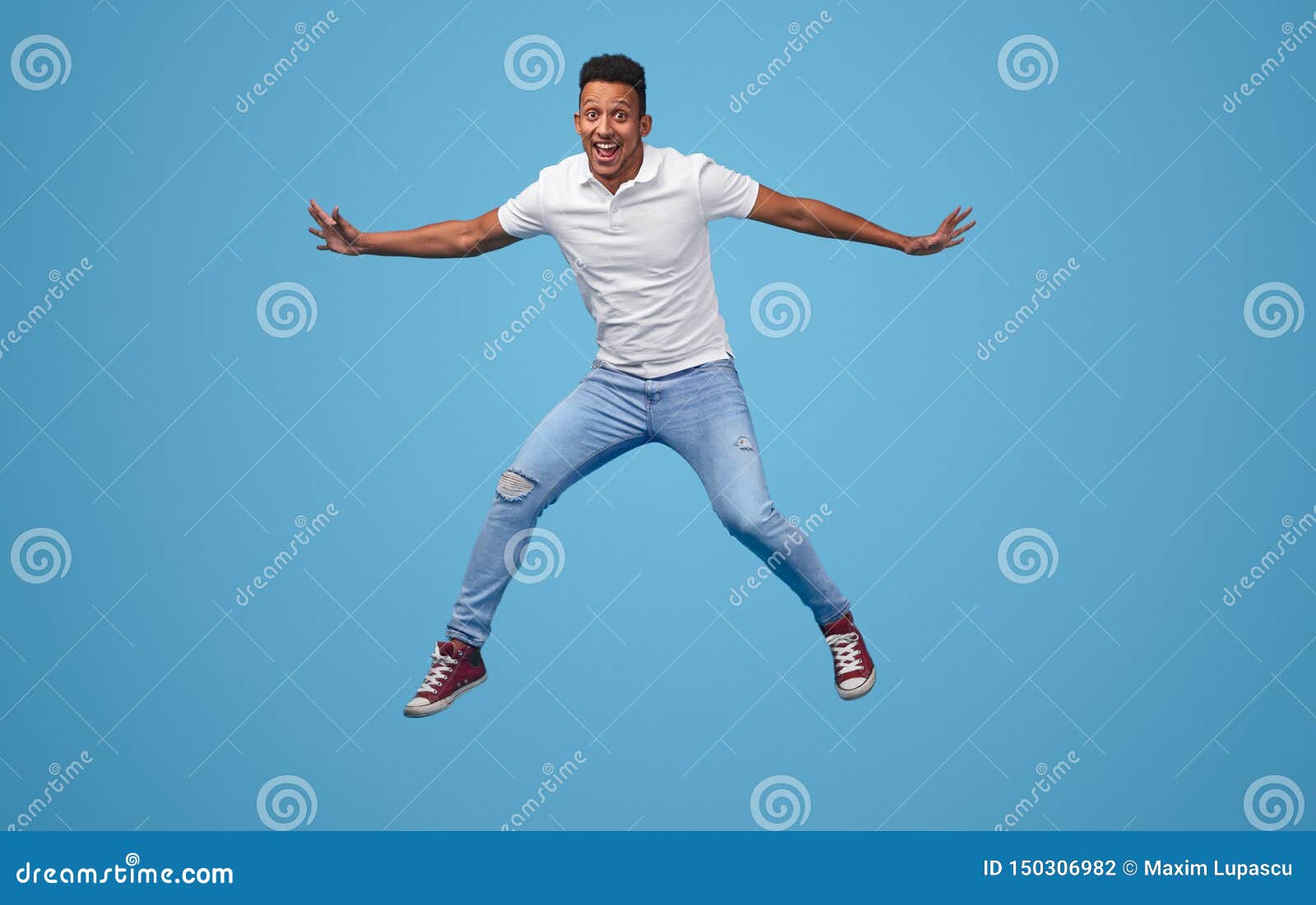 Funny Black Man Jumping and Looking at Camera Stock Photo - Image of  african, freedom: 150306982