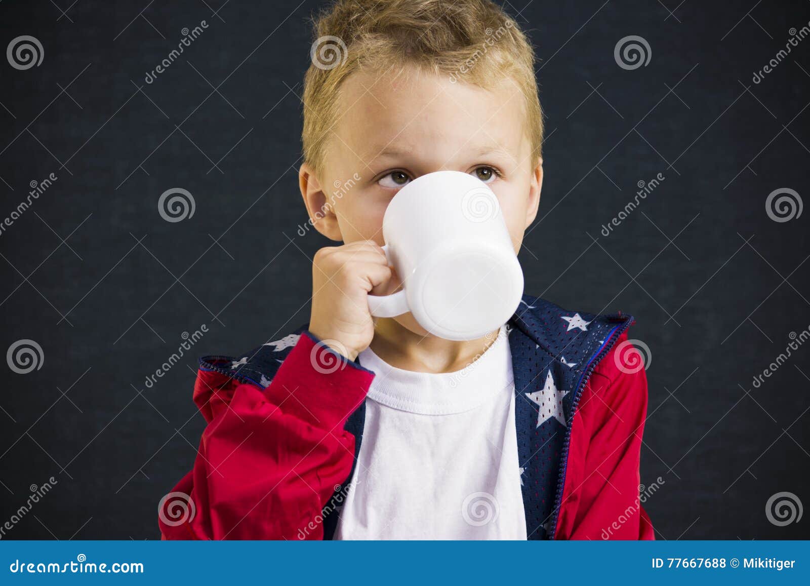 Funny boy drinks tea stock photo. Image of drink, black 77667688