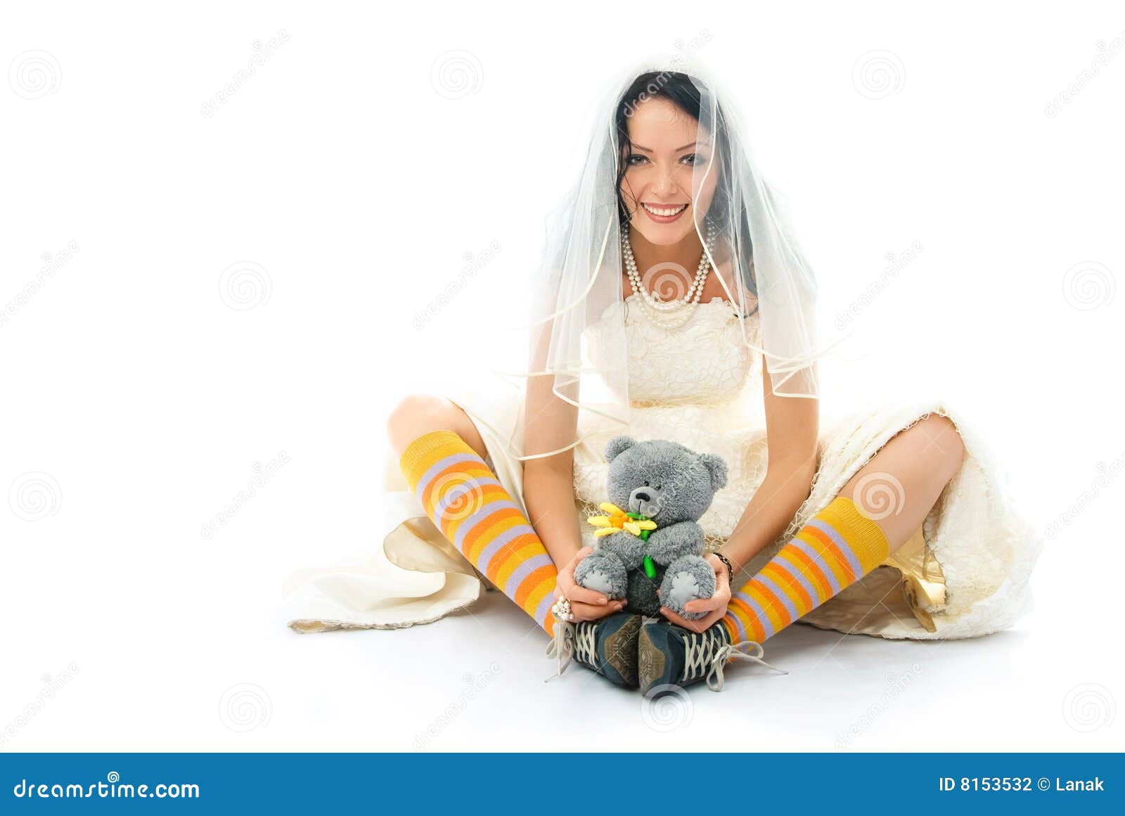 funny bride wearing sporting shoes with a toy