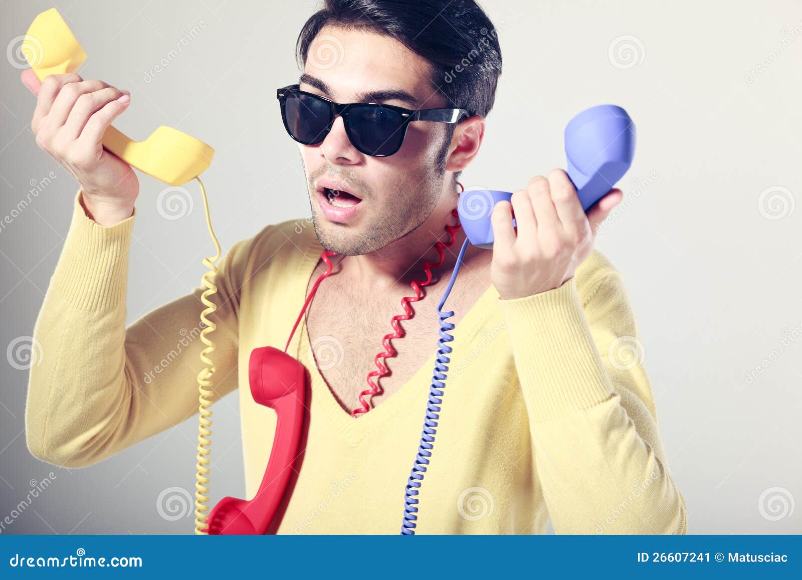 Funny Call Center Guy With Colorful Phones Stock Image - Image: 26607241