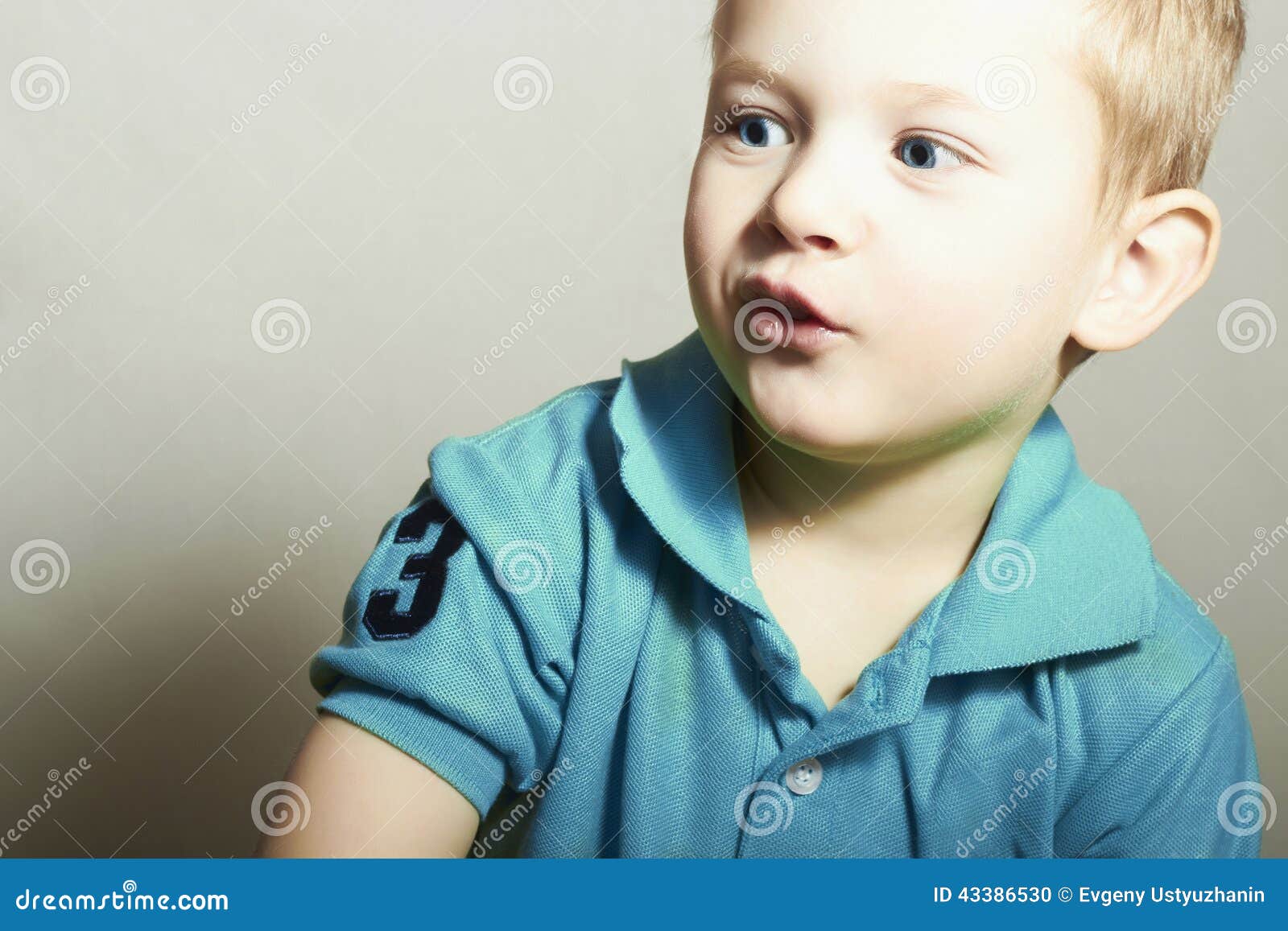 Funny Child. Little Boy With Blue Eyes. Close-up Portrait 